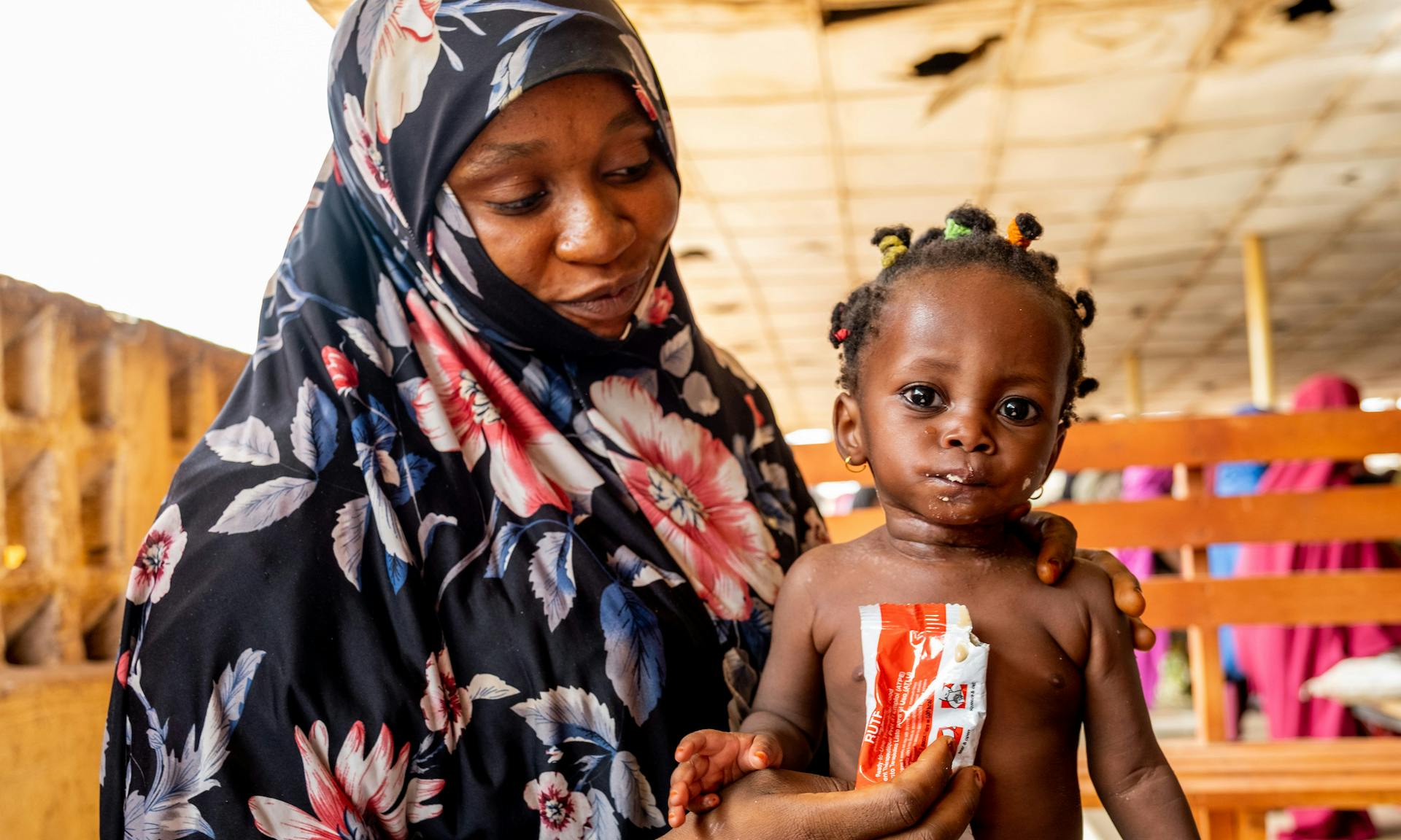 Hafsat is 7-months old, she's eating ready-to-use therapeutic food (RUTF) which is helping save her from malnutrition.