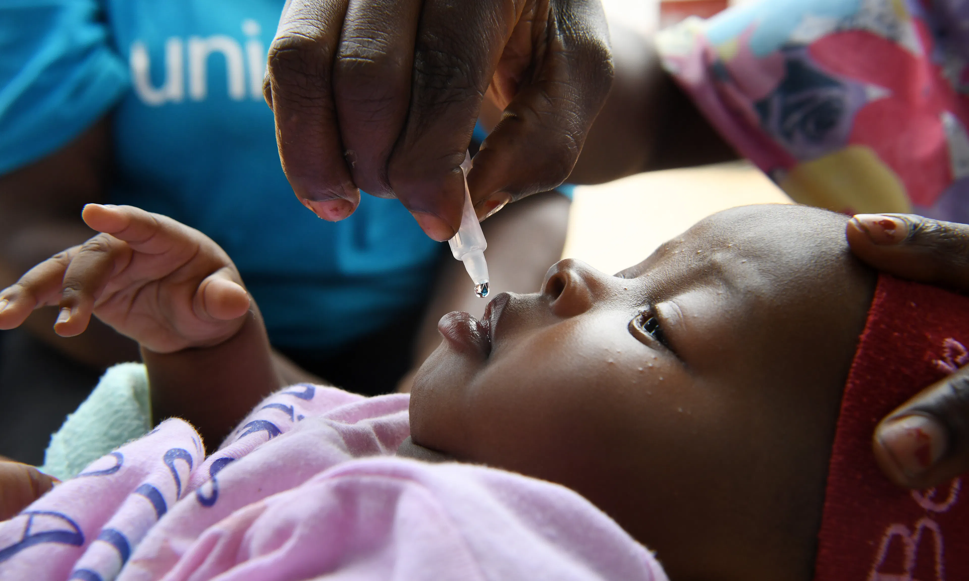Baby girl being immunised