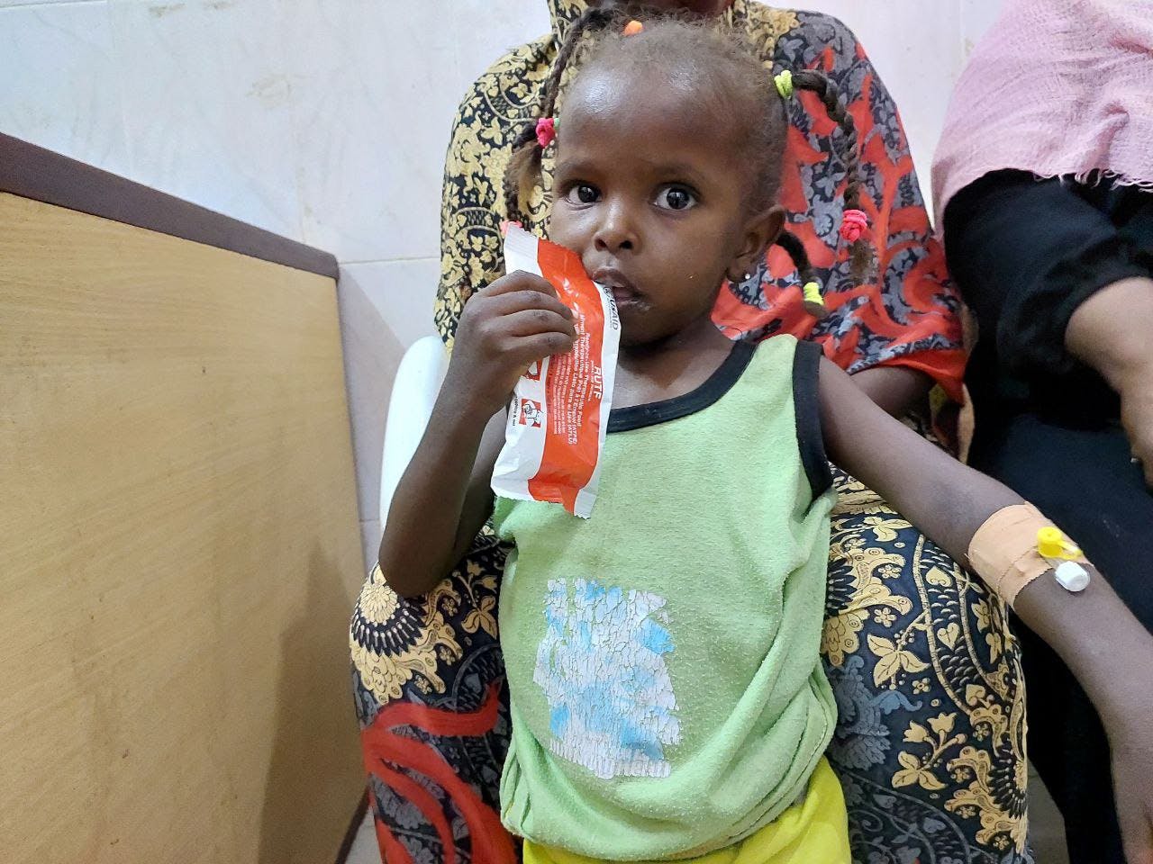 On 1 June, 3-year-old daughter, AlBatoul Taj-Elsir eats ready-to-use-therapeutic food (RUTF) in the nutrition ward at Dongola specialized hospital, where she is receiving treatment for severe acute malnutrition.