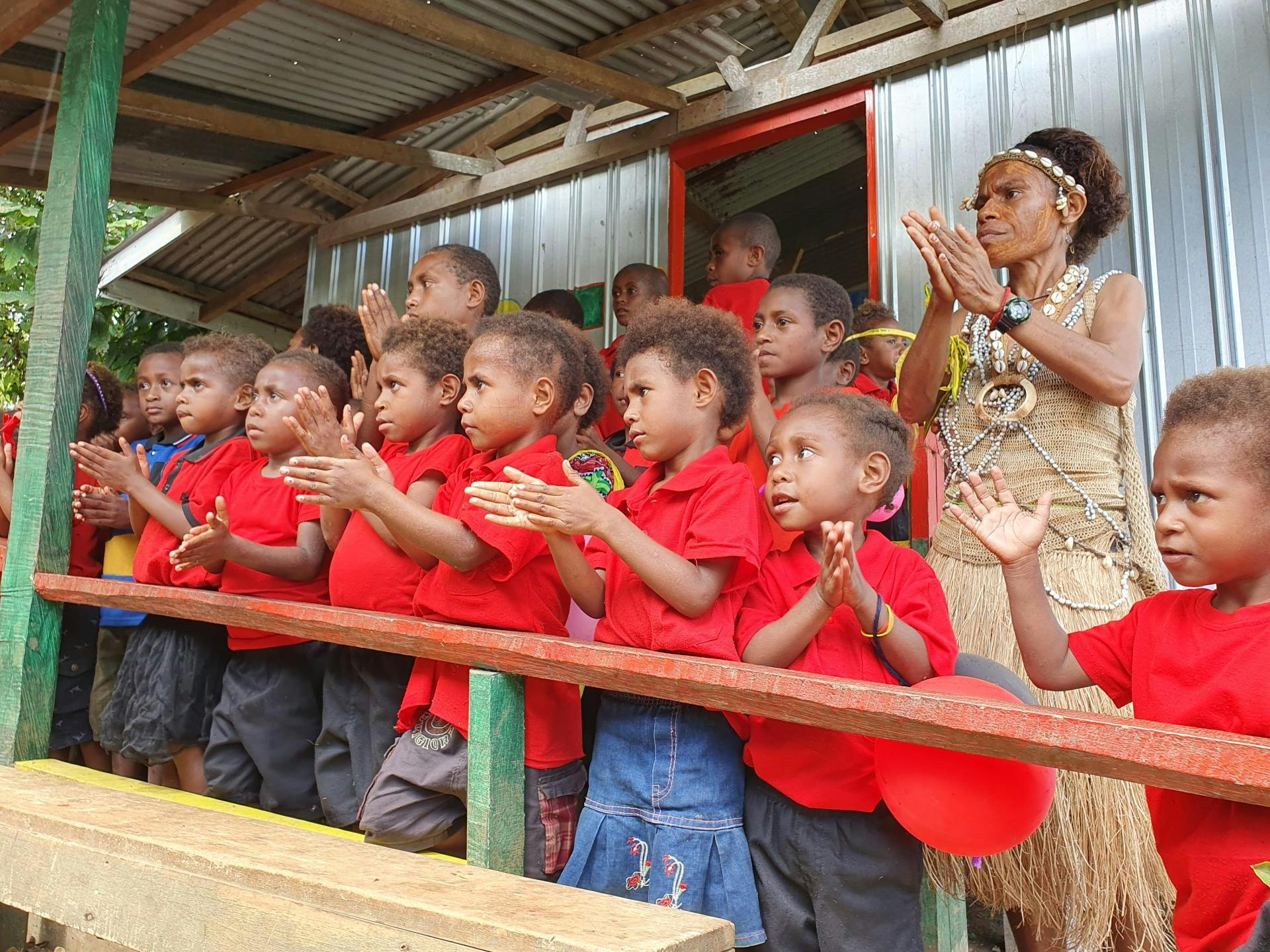 Preschool children in Hobu early childhood centre demonstrate the handwashing song they learn in class.