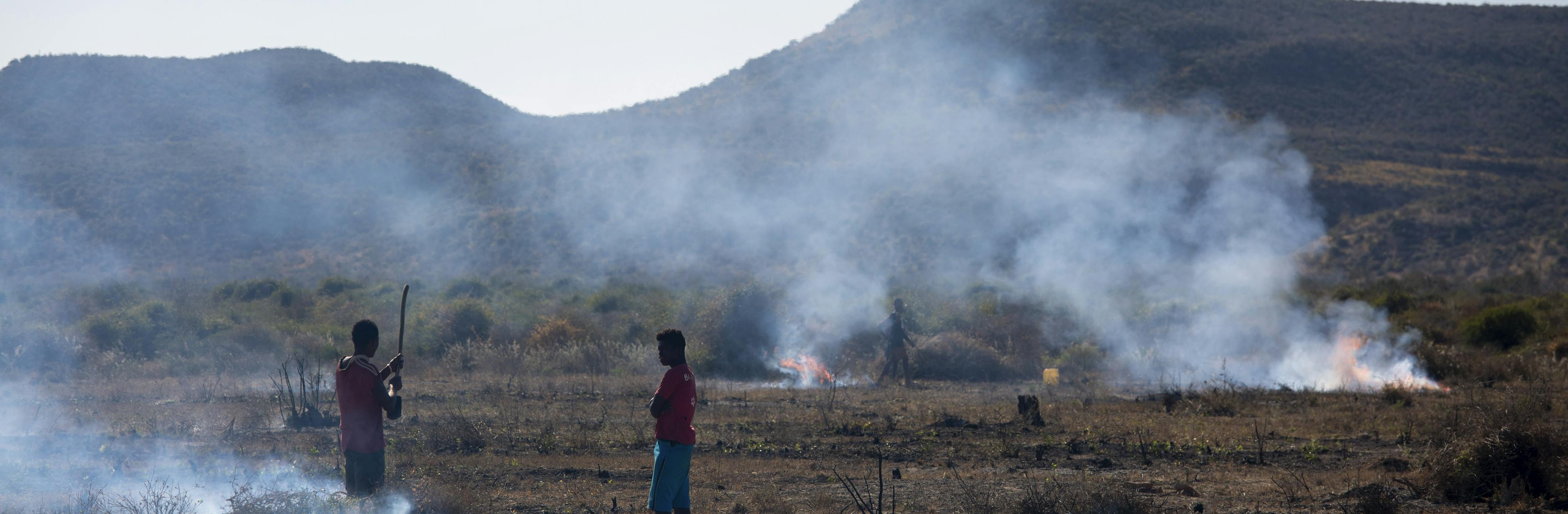 Men burning rubbish in Madagascar - Environmental degradation caused by waste burning