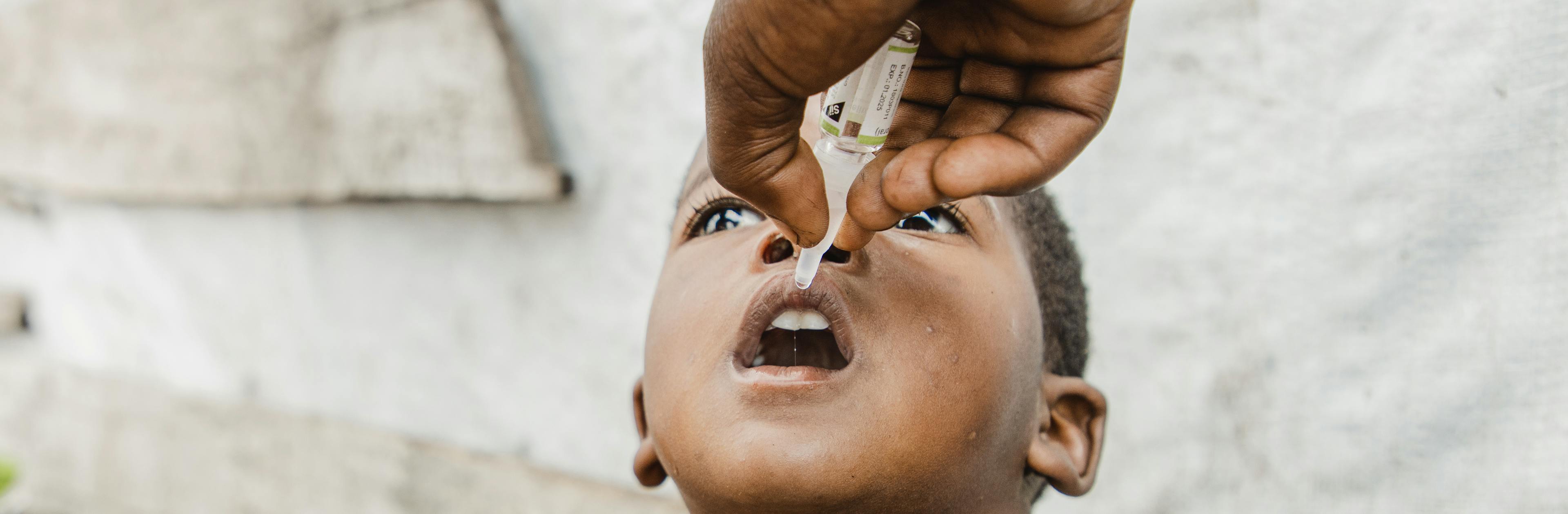 A displaced child is vaccinated against polio at the Bulengo site for displaced persons in Goma, North Kivu, DR Congo, August 11, 2023.  UNICEF is supporting a large-scale vaccination campaign to protect more than 23 million children across the country.