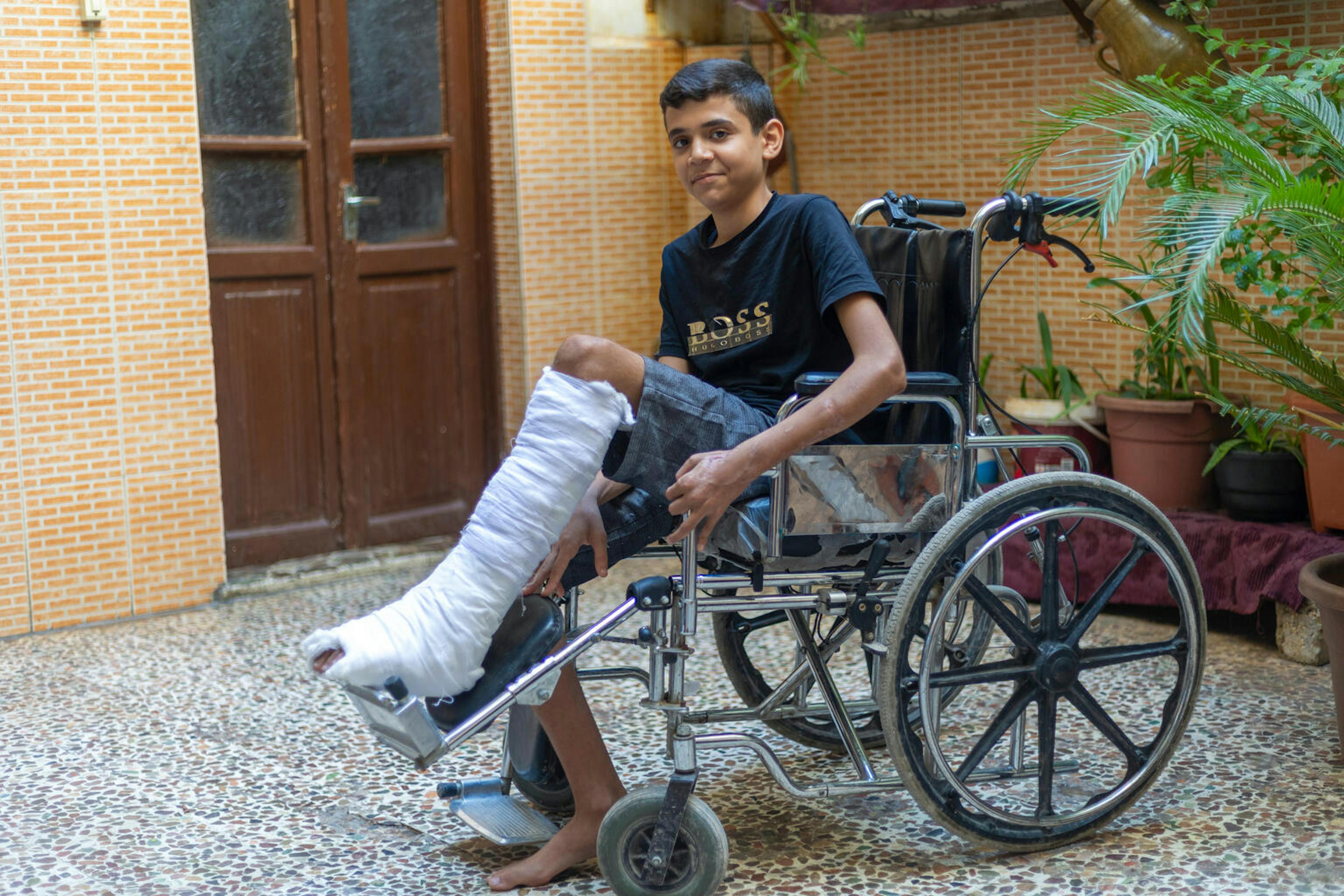 Hope and Resilience in Türkiye and Syria - An injured boy is able to continue his studies after surgeries.