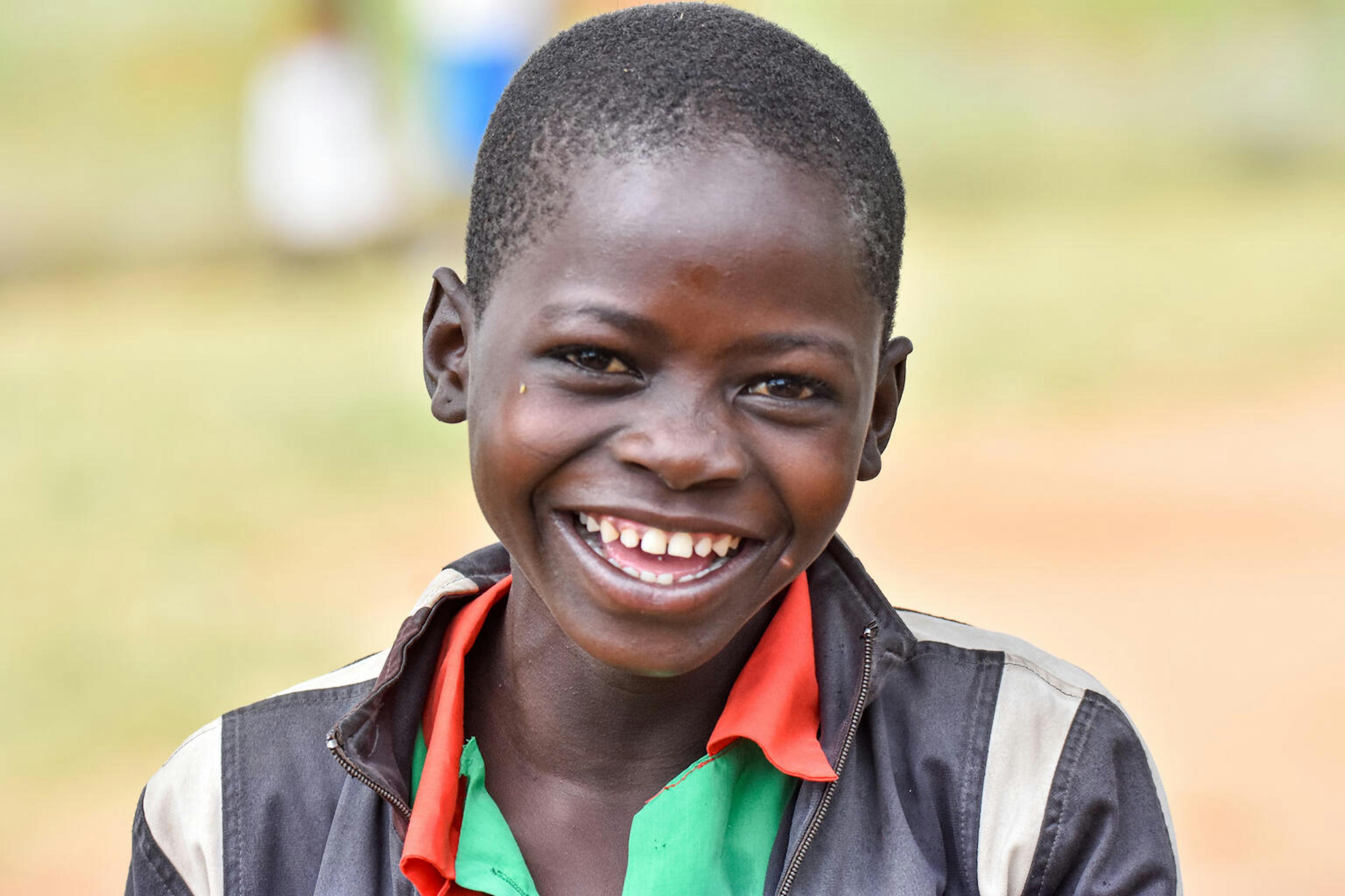 A young boy smiling at the camera 