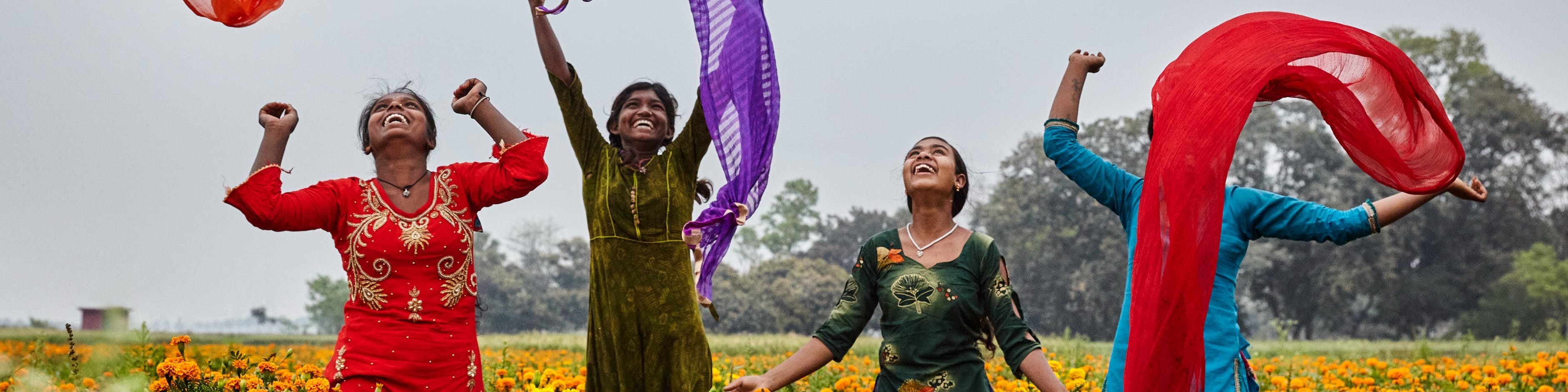 Corporate Partnerships- A group of adolescent girls enjoy a light moment together