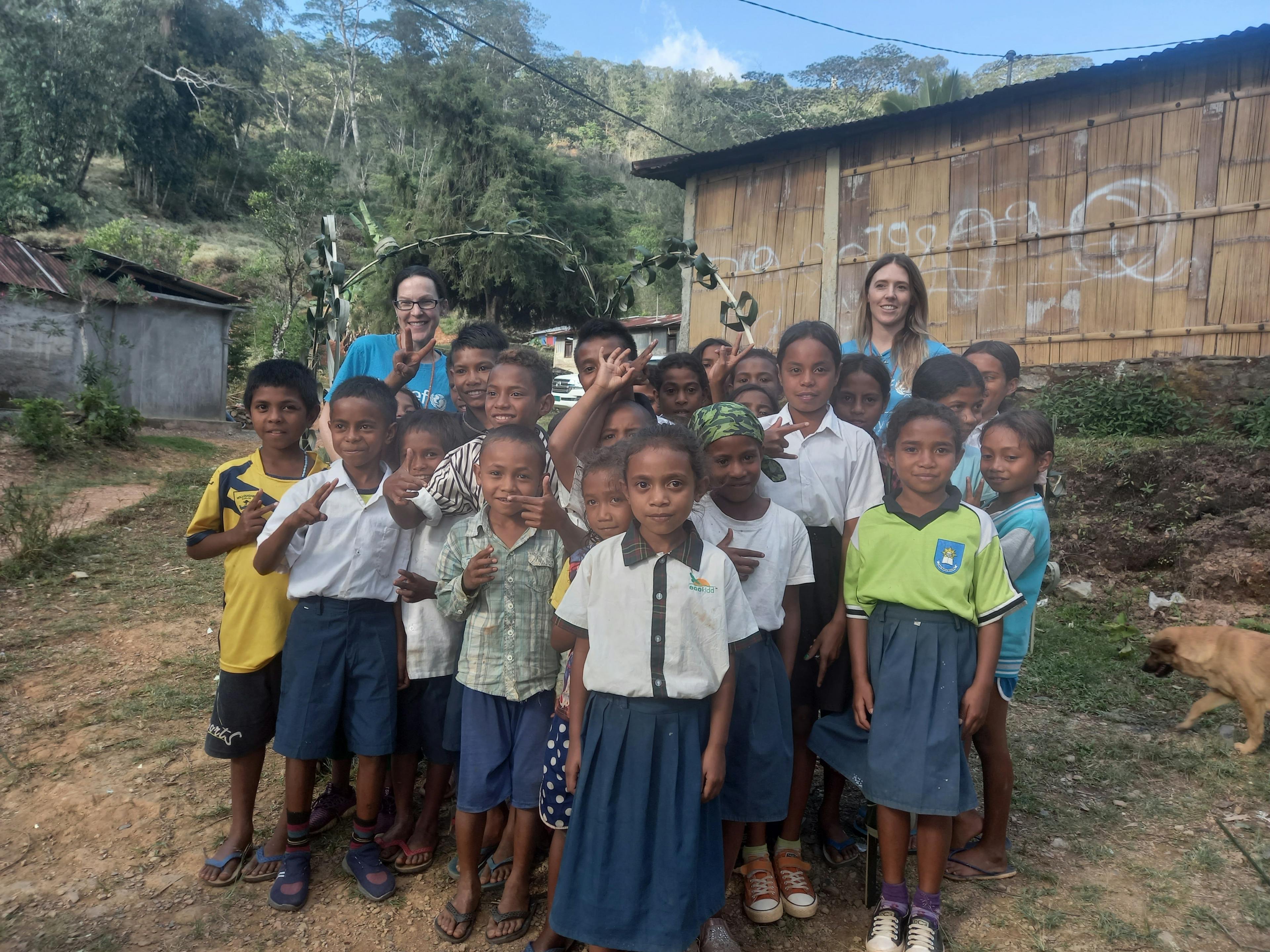 A group photo with some of the children who welcomed us to Kairia preschool in Letafoho. We are standing in front of the palm leaf archway they made for our arrival. I’m at the back on the far left with my colleague Charlotte (UNICEF Australia) on the right.