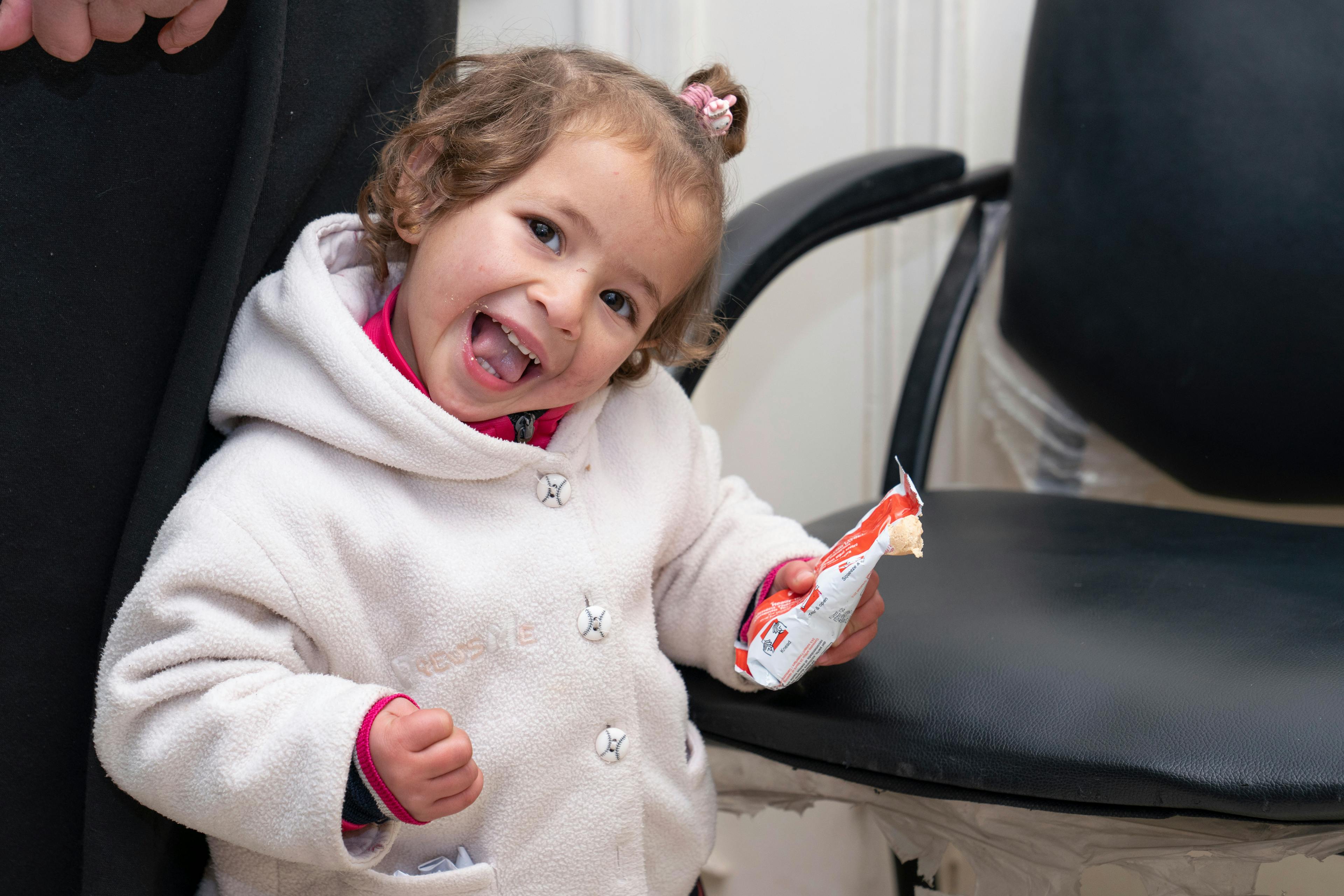 Amina, 1.5, during her check-up with her mother Zohuor, at a UNICEF-supported clinic. She is receiving treatment for severe wasting in Deir ez- zor city, Syria, on 17 January 2023.