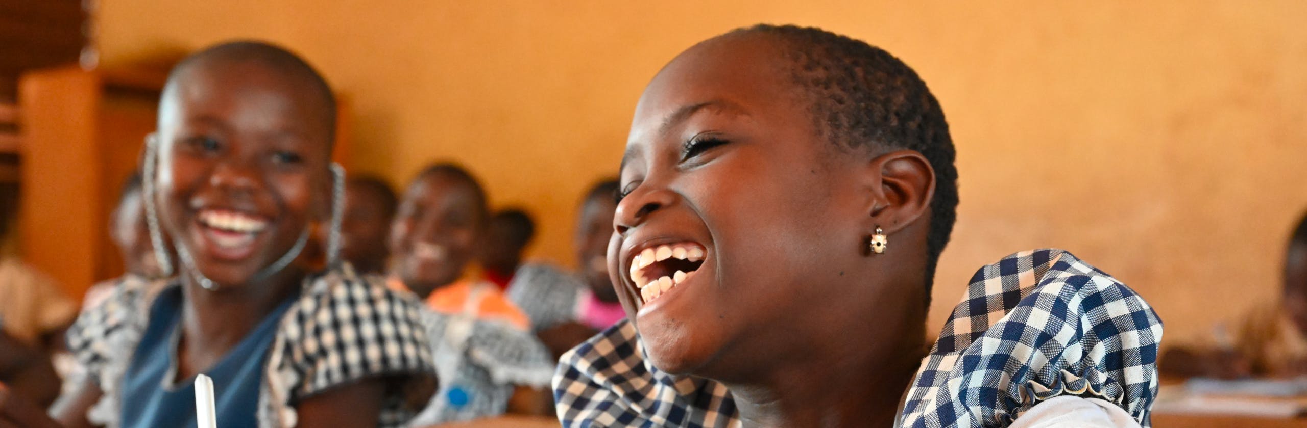 Education- A happy girl attending class in the village of Nambonkaha, in the North of Côte d’Ivoire