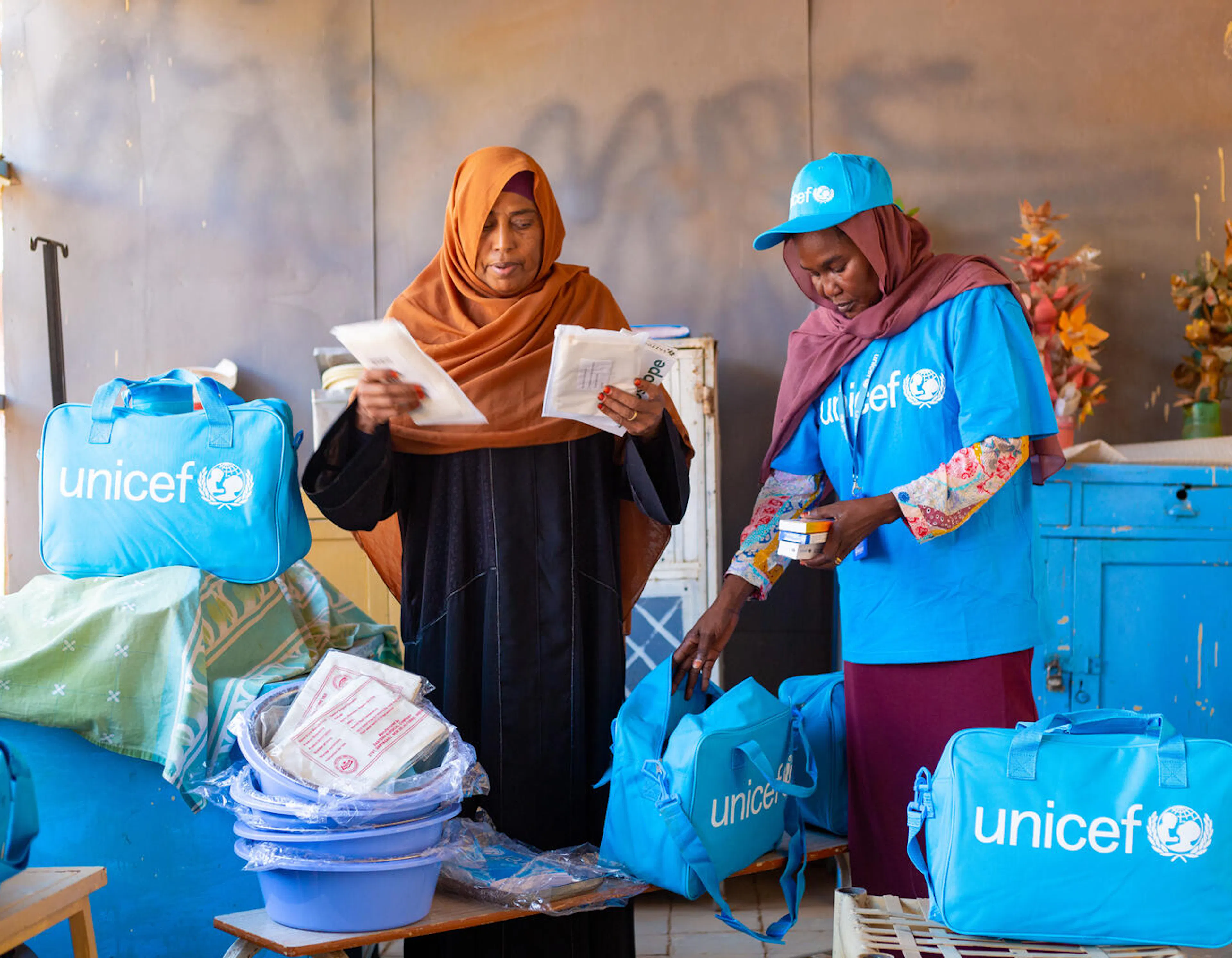 Dr. Fatima, Reproductive Health Director and Dr. Ehsan Mohammed, UNICEF Health Officer prepare midwifery kits.