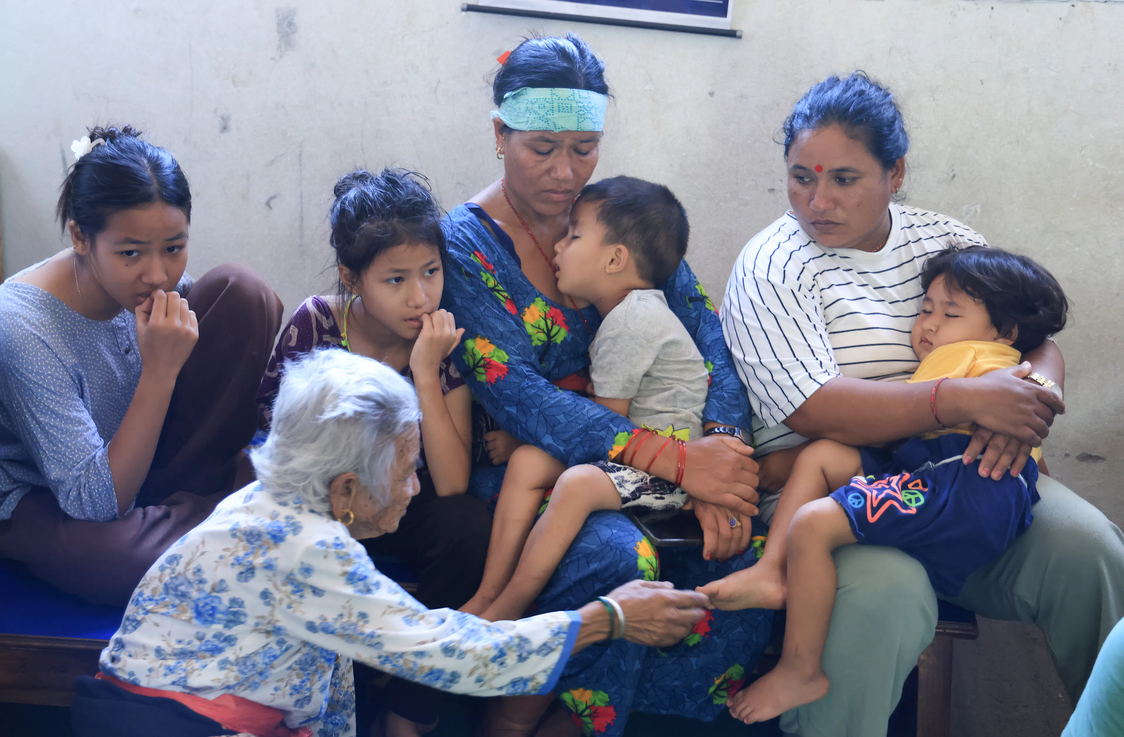 A family sheltering in a school in Nuwakot District, Bagmati Province, Nepal after floods destroyed their homes.