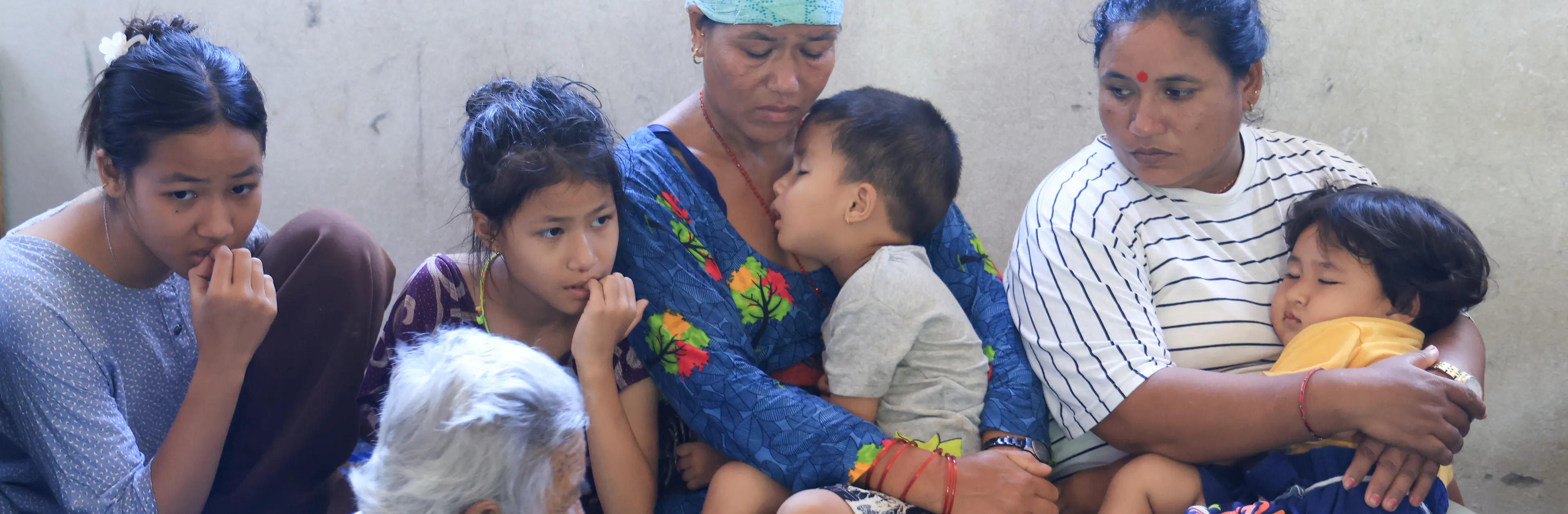 A family sheltering in a school in Nuwakot District, Bagmati Province, Nepal after floods destroyed their homes.