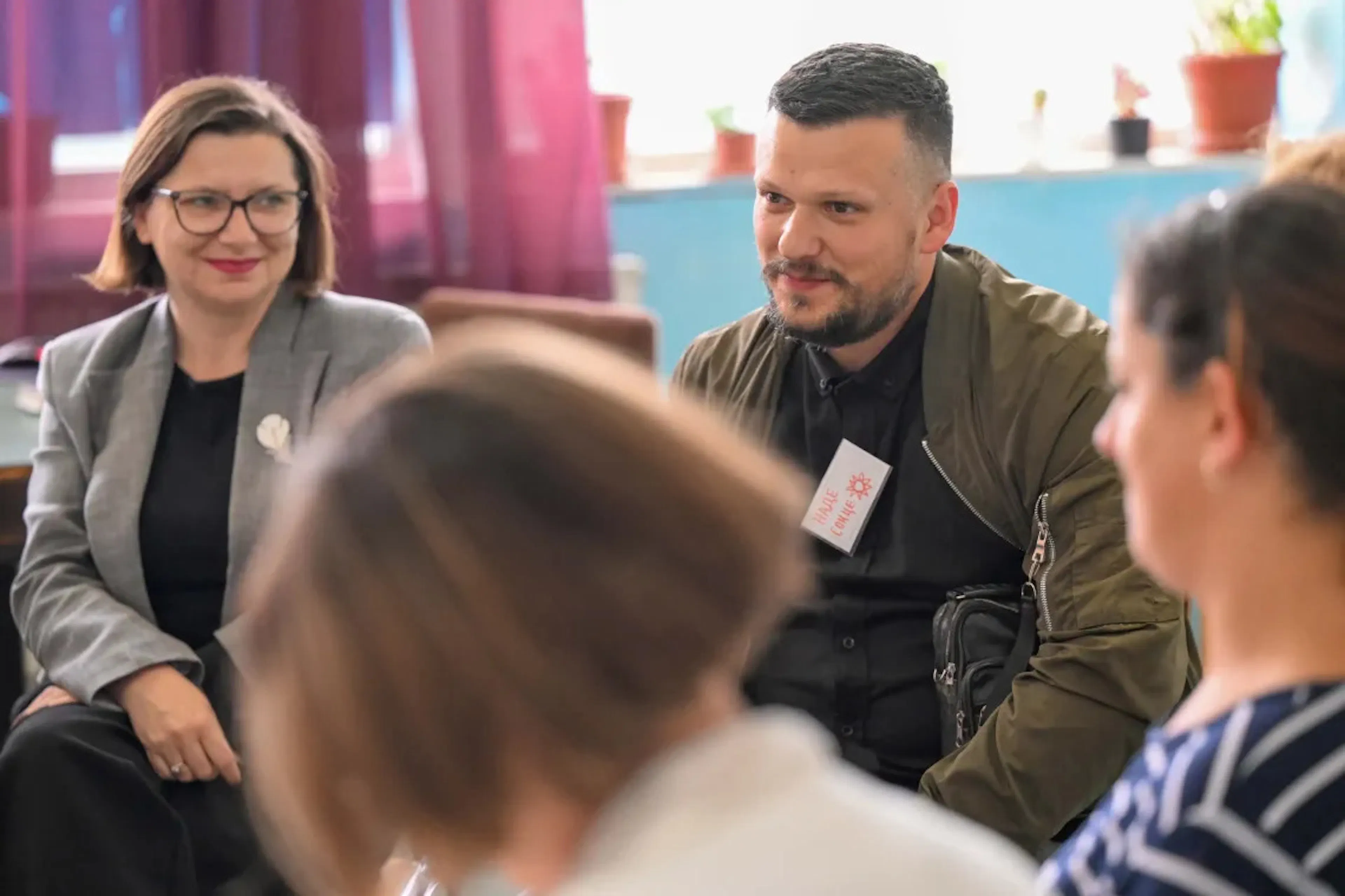 School principal Biljana Temelkovska listens as participant Vladimir (father) contributes to a group discussion during a parenting programme session.