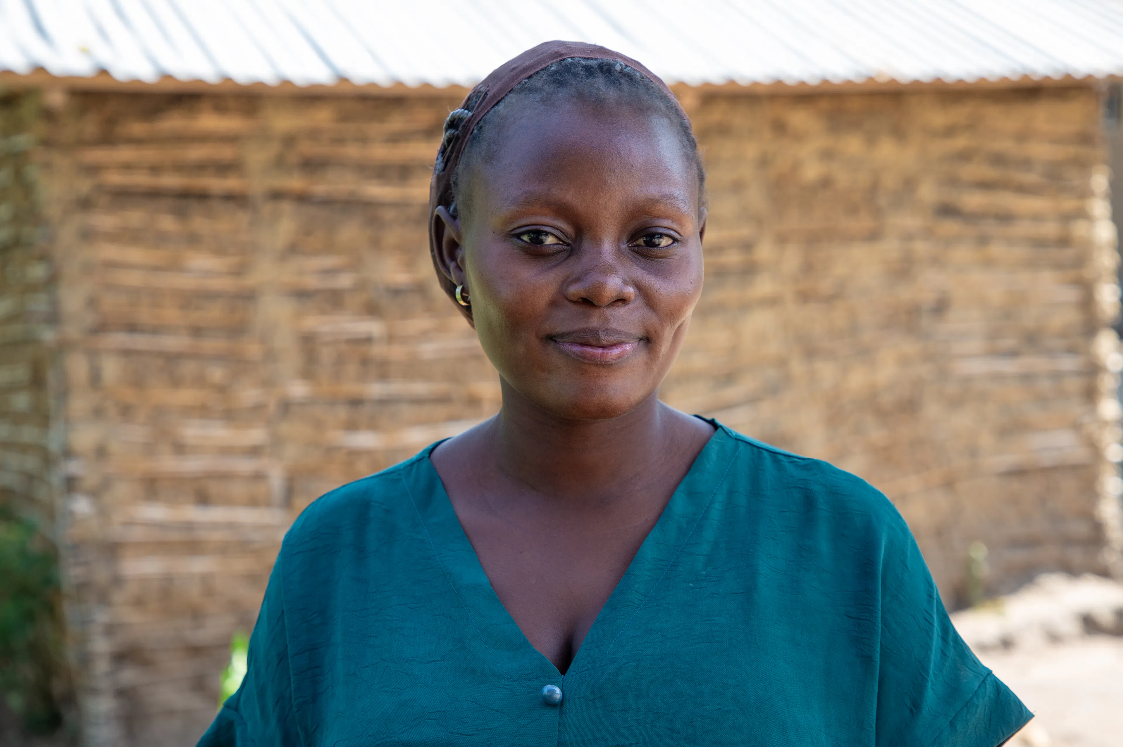 Gloria Angomgio Ezile, 23, student, explains Ebola safeguards, at Rwampara, Ituri, DRC, on june 8, 2026.  