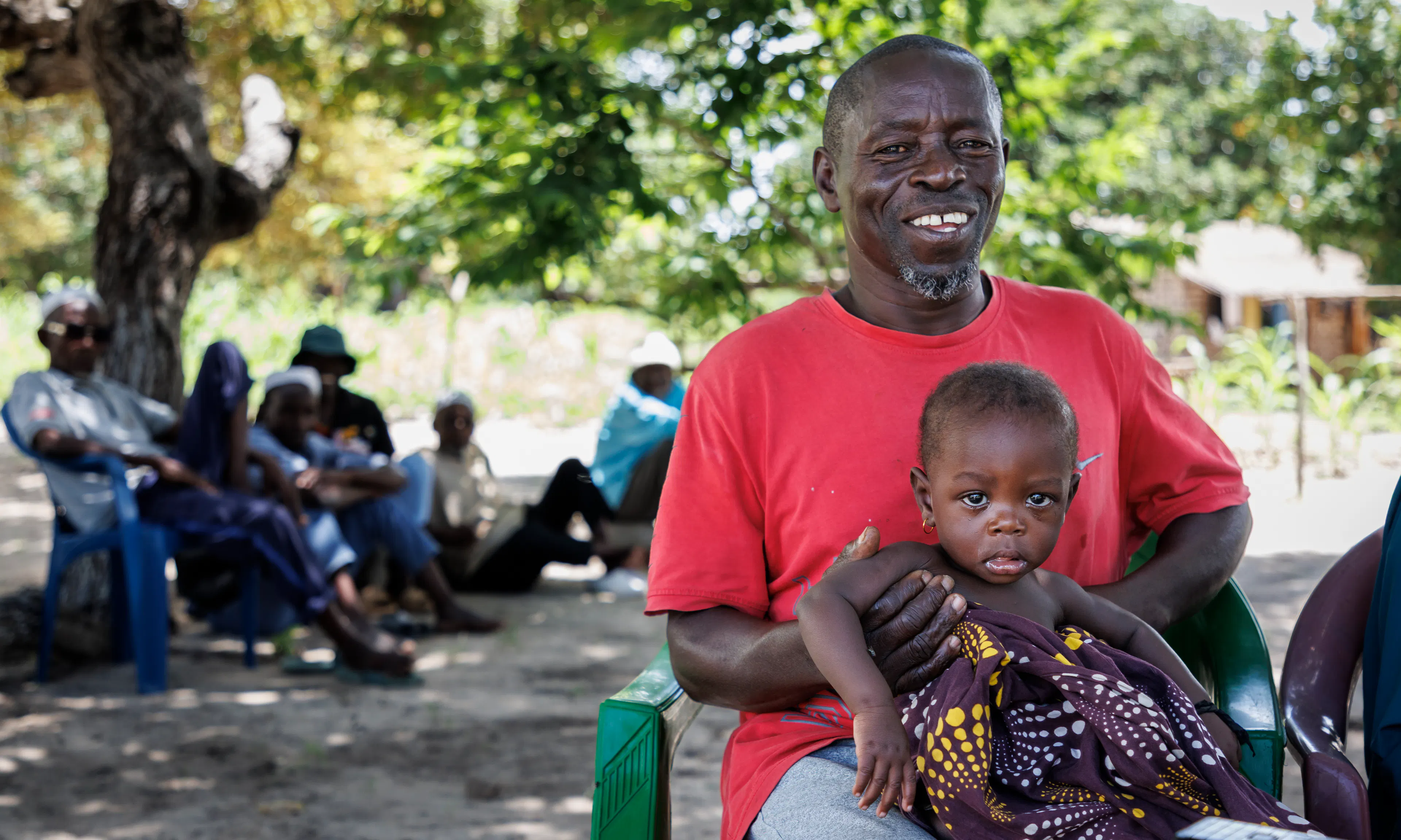 53-year-old Salimo Iaquide is a farmer and father of nine. He has brought his youngest child, eight-month-old Nilza Salimo, for her monthly check-up.