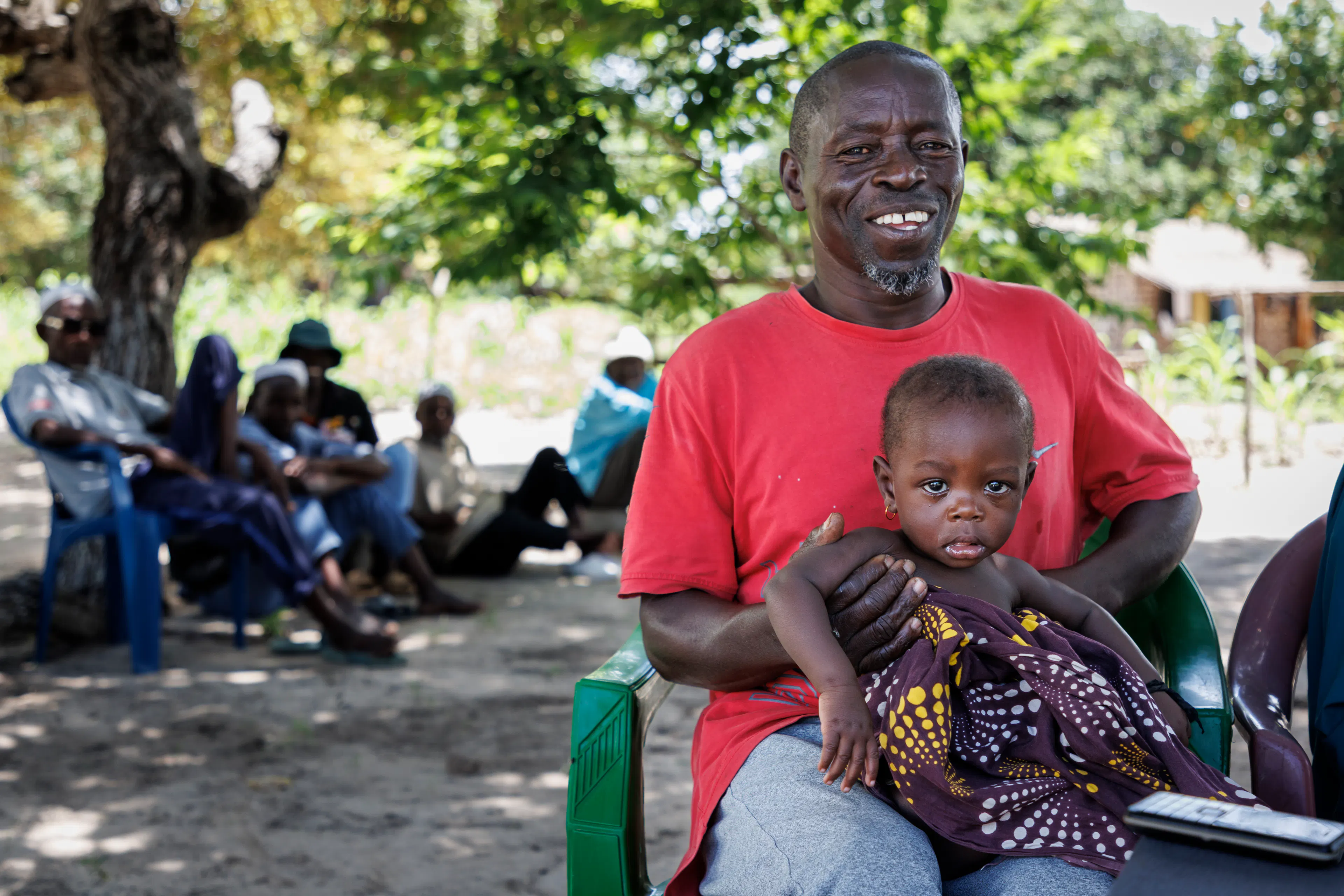 53-year-old Salimo Iaquide is a farmer and father of nine. He has brought his youngest child, eight-month-old Nilza Salimo, for her monthly check-up.