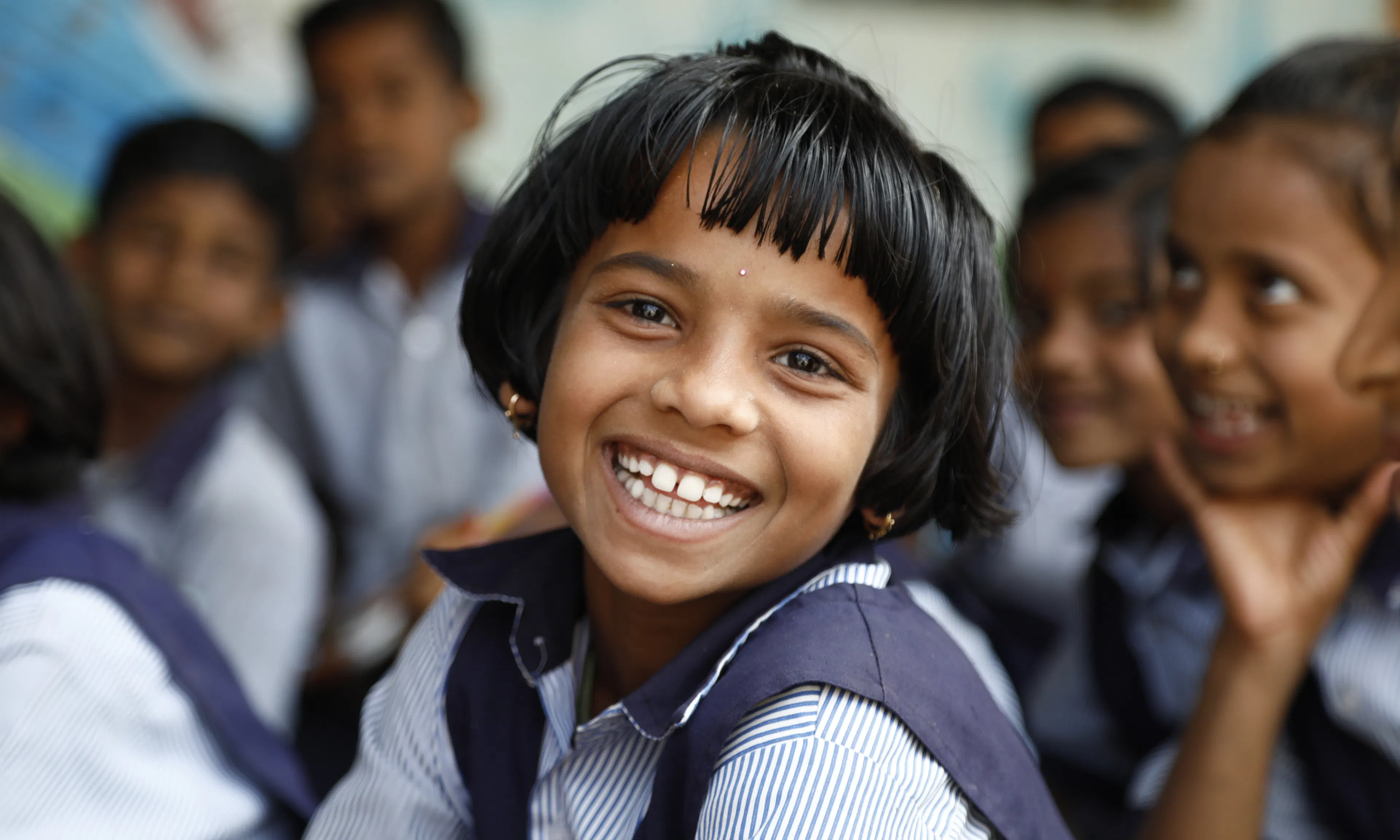 Shokanya, a Grade 3 student, smiles while participating in a gender activity at the Zilla Parishad Primary School in Bamani, Dharashiv district, Maharashtra.