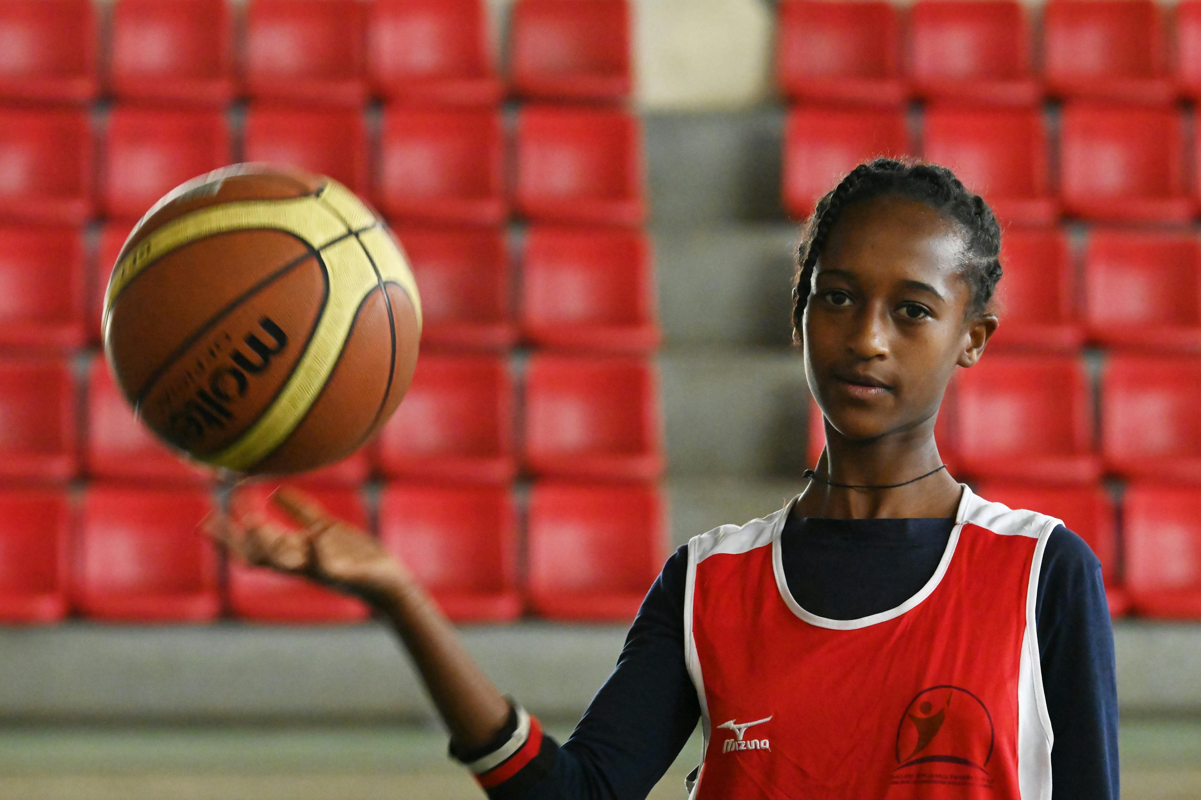 Biruktait Tesfaye, a 13 year old girl, plays basketball, in Addis Ababa, the capital of Ethiopia. The Food urbanism initiative supports local production and consumption of nutritious, safe, affordable and sustainable foods among adolescents and youths living in urban settings of Ethiopia.