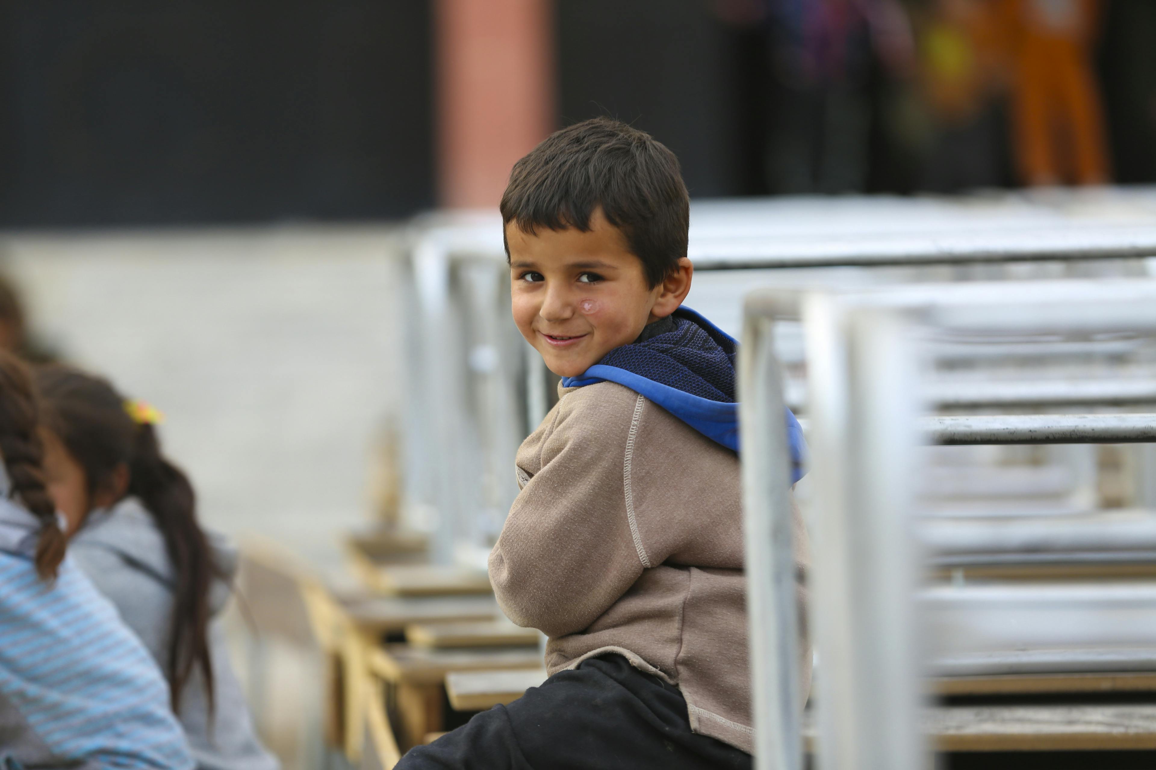 A boy from a newly arrived family at a shelter in Ar-Raqqa city, Syria, on 4 December 2024, who fled the escalating violence in Aleppo

