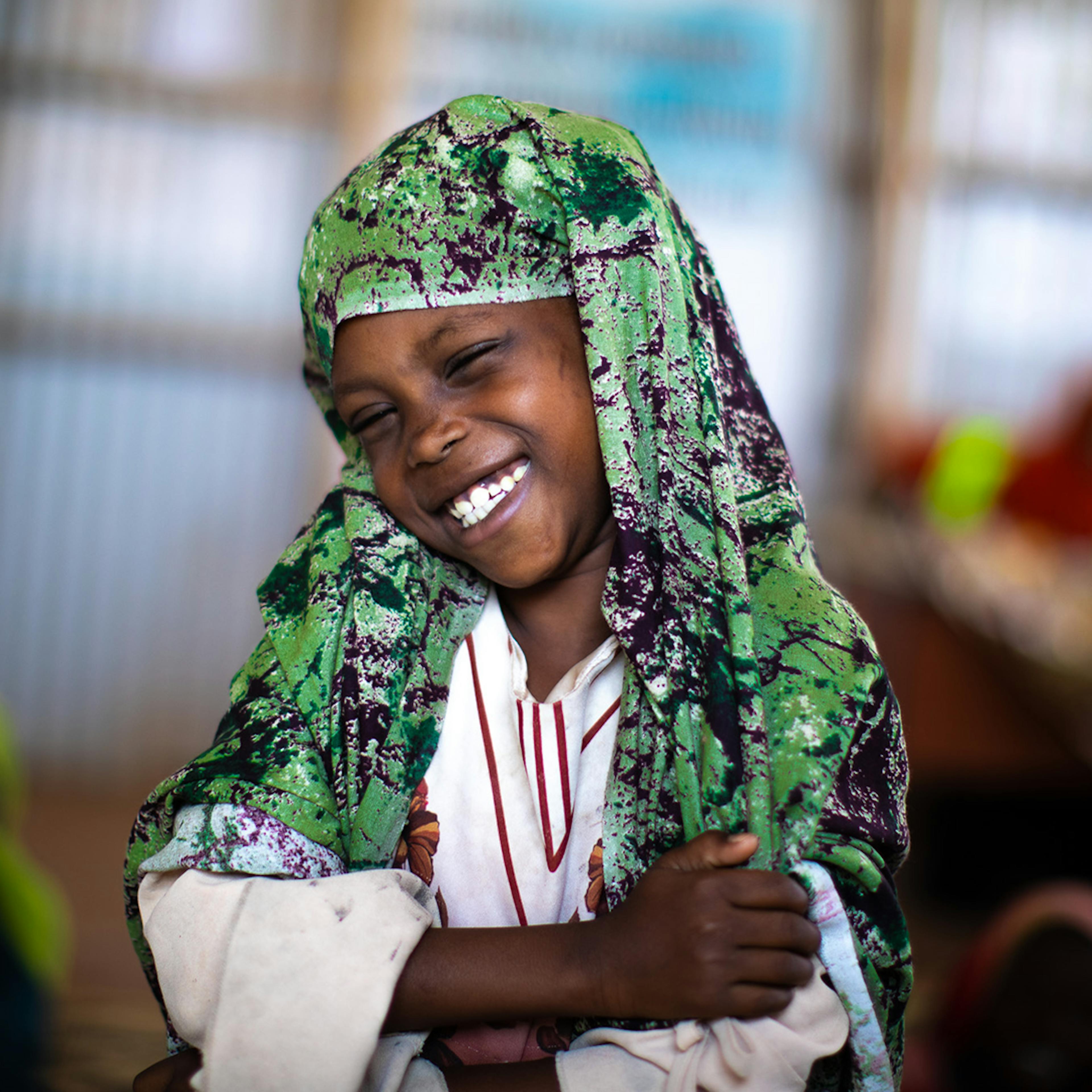 Shaymo loves coming to the child-friendly space implemented by UNICEF, because she can play and laugh with her friends... in short, live her child's life.