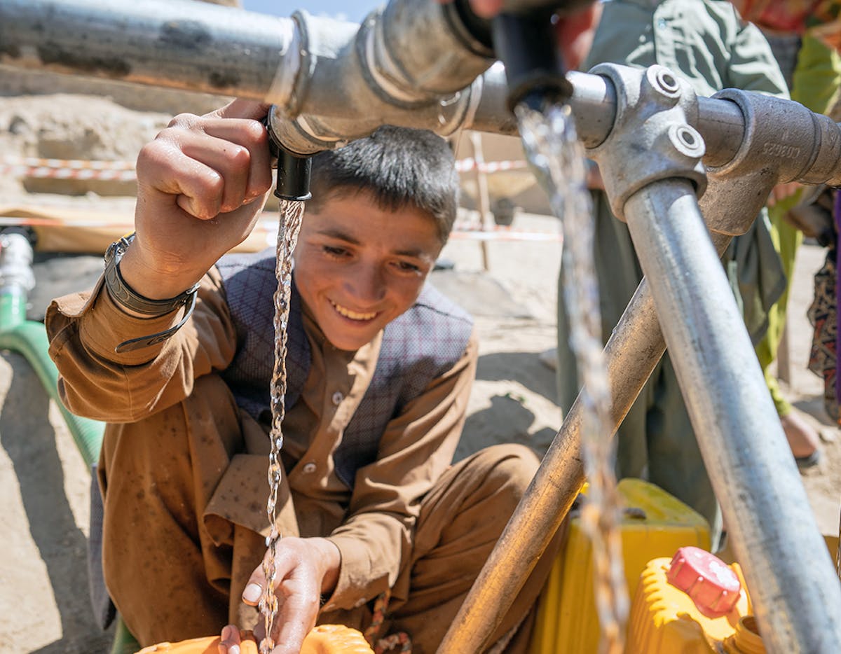 On the 28th May 2024, 13 year old Mustapha fills his jerry can with water provided by UNICEF in Chaghcharan district, Ghor province in western Afghanistan.