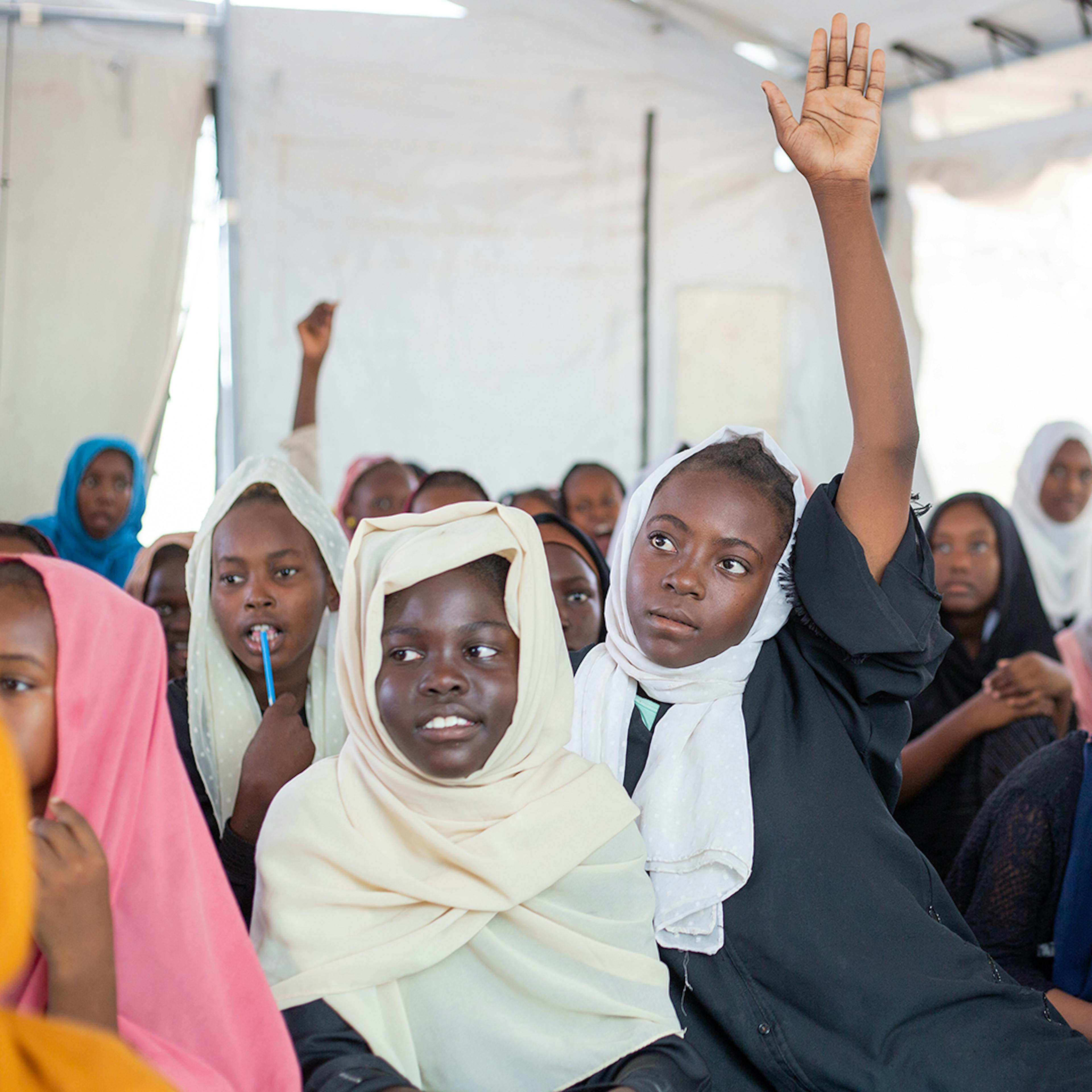 13-year-old Mehad (middle) participates in a session at a safe learning space (SLS) set up by UNICEF at Al Maimona gathering point Hantob, Gezira state.