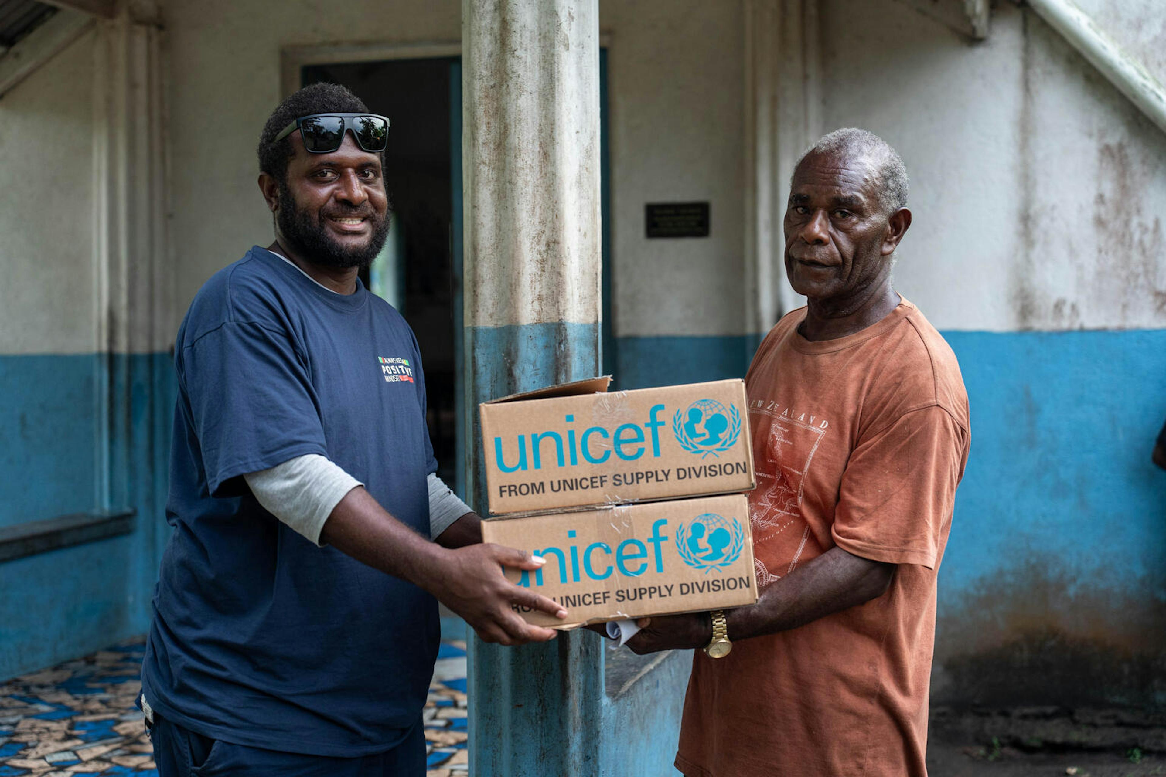 UNICEF Vanuatu partner Promedical delivering UNICEF First Aid Kits to the Waisisi Village chief - Chief Manaula. Waisisi, Efate, SHEFA, Vanuatu