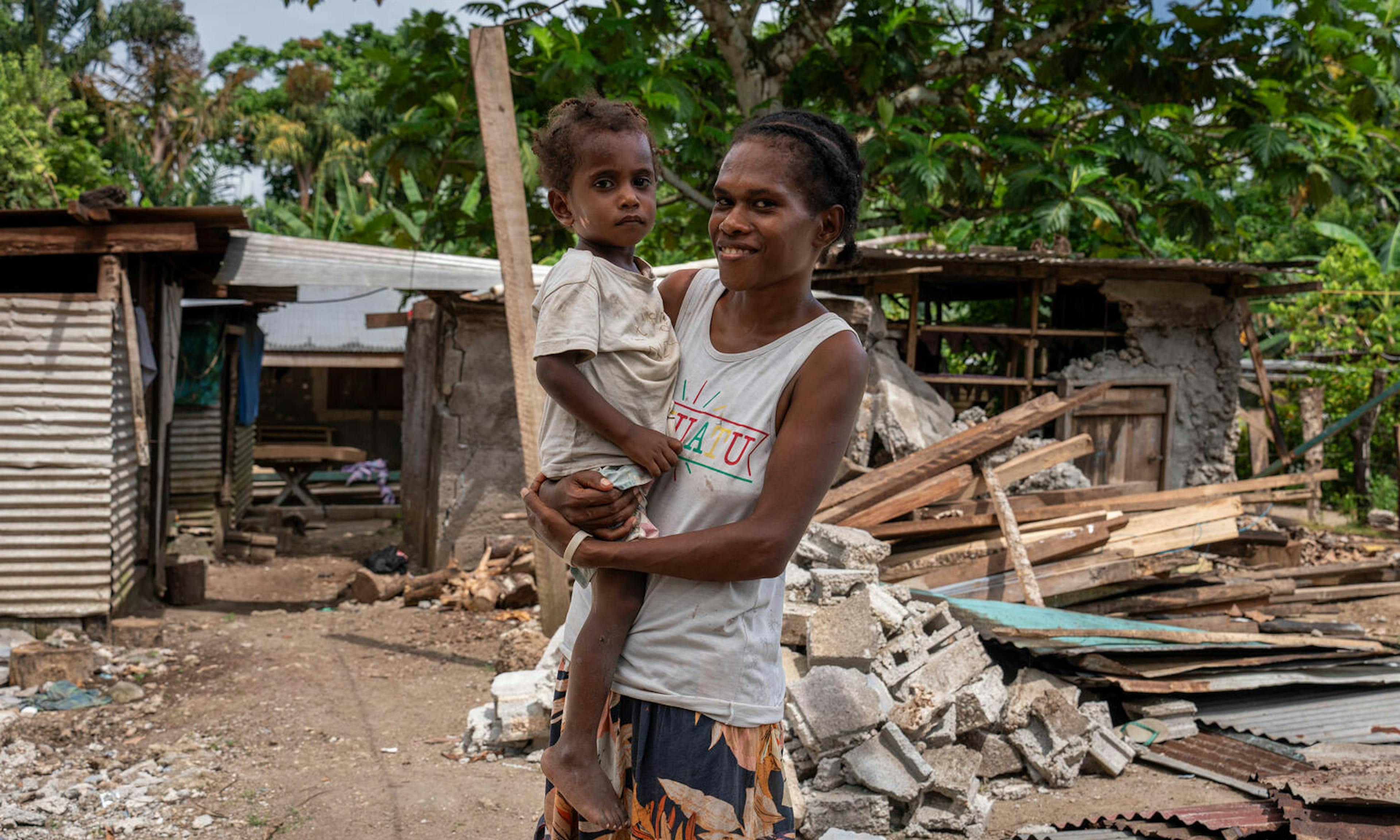 Mother Alice and her 3 year old son Samuel who was buried alive leaving only his face uncovered in a landslide at Mele Maat Village caused by the Earthquake. Samuel was pulled from the landslide and survived.