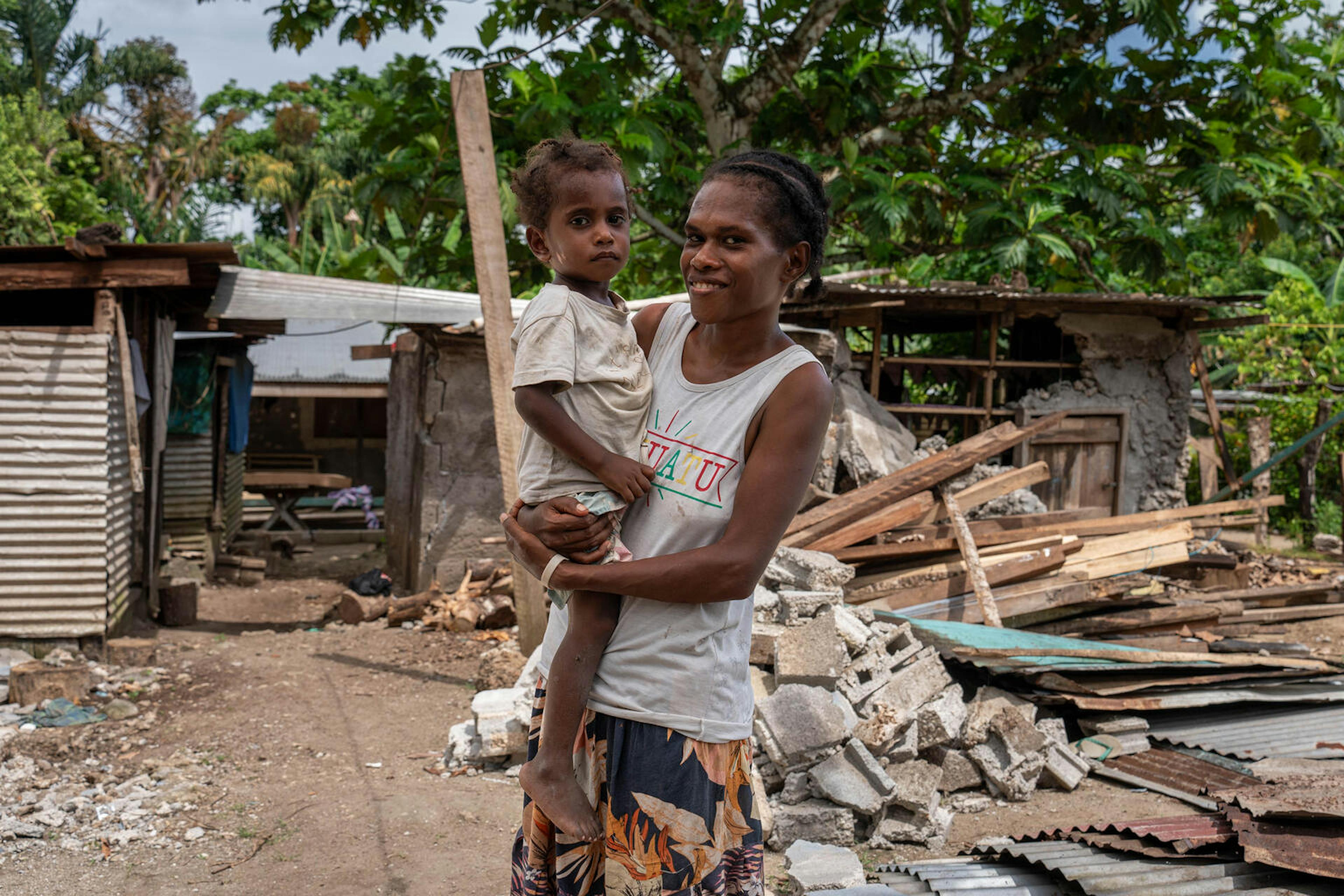 Mother Alice and her 3 year old son Samuel who was buried alive leaving only his face uncovered in a landslide at Mele Maat Village caused by the Earthquake. Samuel was pulled from the landslide and survived.