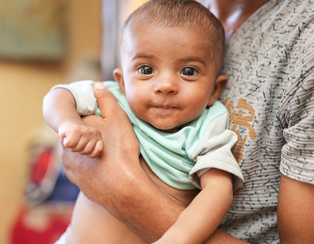 On 18 May 2023, 7-month-old baby boy Sanad is held by his father, Sameh, at their home in the Al Adani neighbourhood of Al Hawtah, Lahj Governate, Yemen.