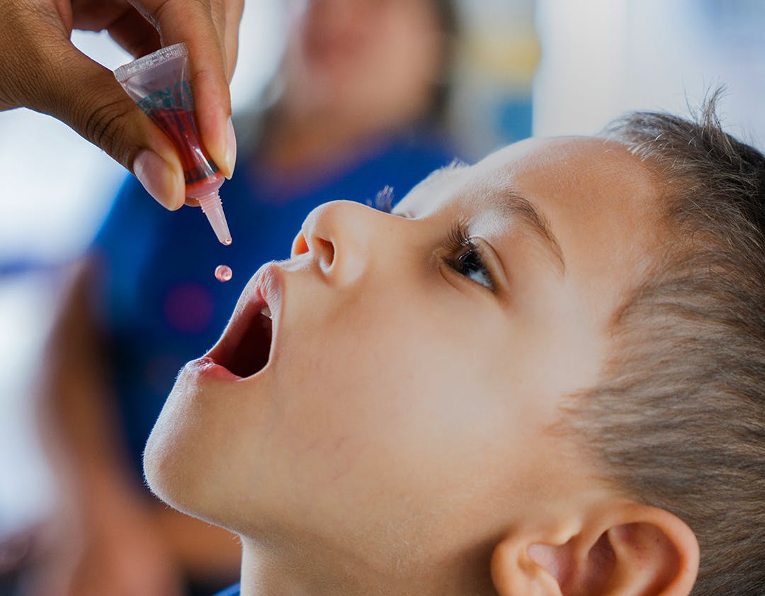 On 31 March 2023, a nurse administers the oral polio vaccine (OPV) vaccine to Samuel, 4, at the Early Childhood Education Centre Rocilda Germano Arruda in Baturité, Ceará state, Brazil.
