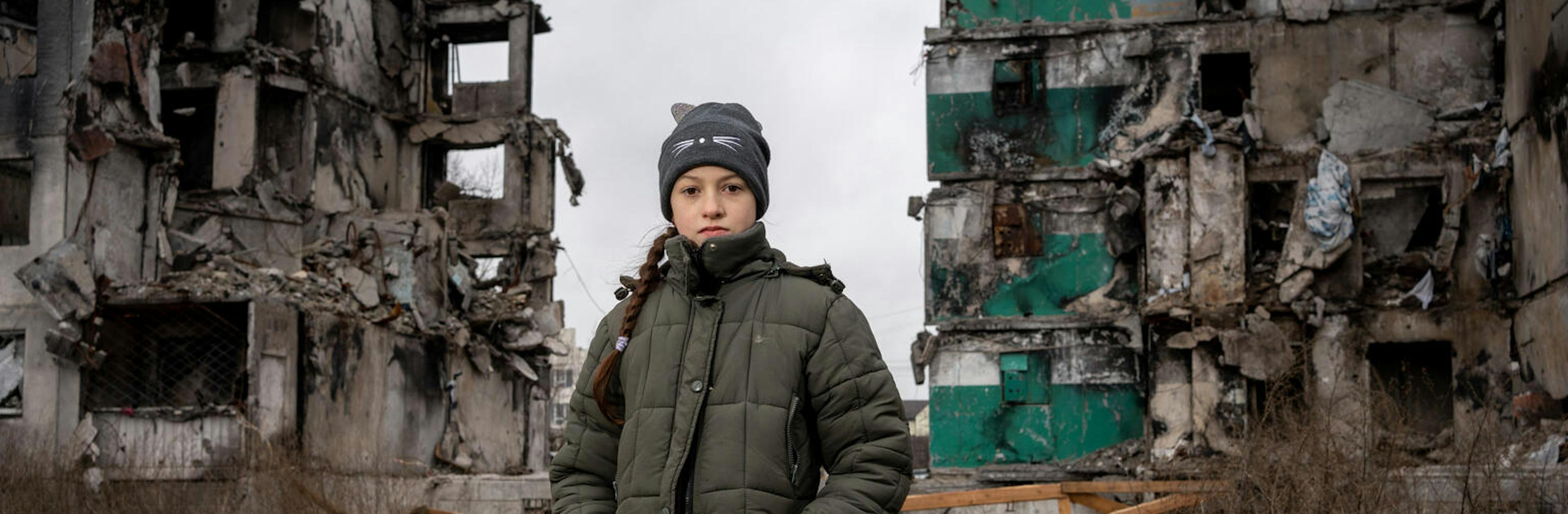 10-year-old Veronica visits the ruins of a high-rise building in the centre of Borodianka, Ukraine