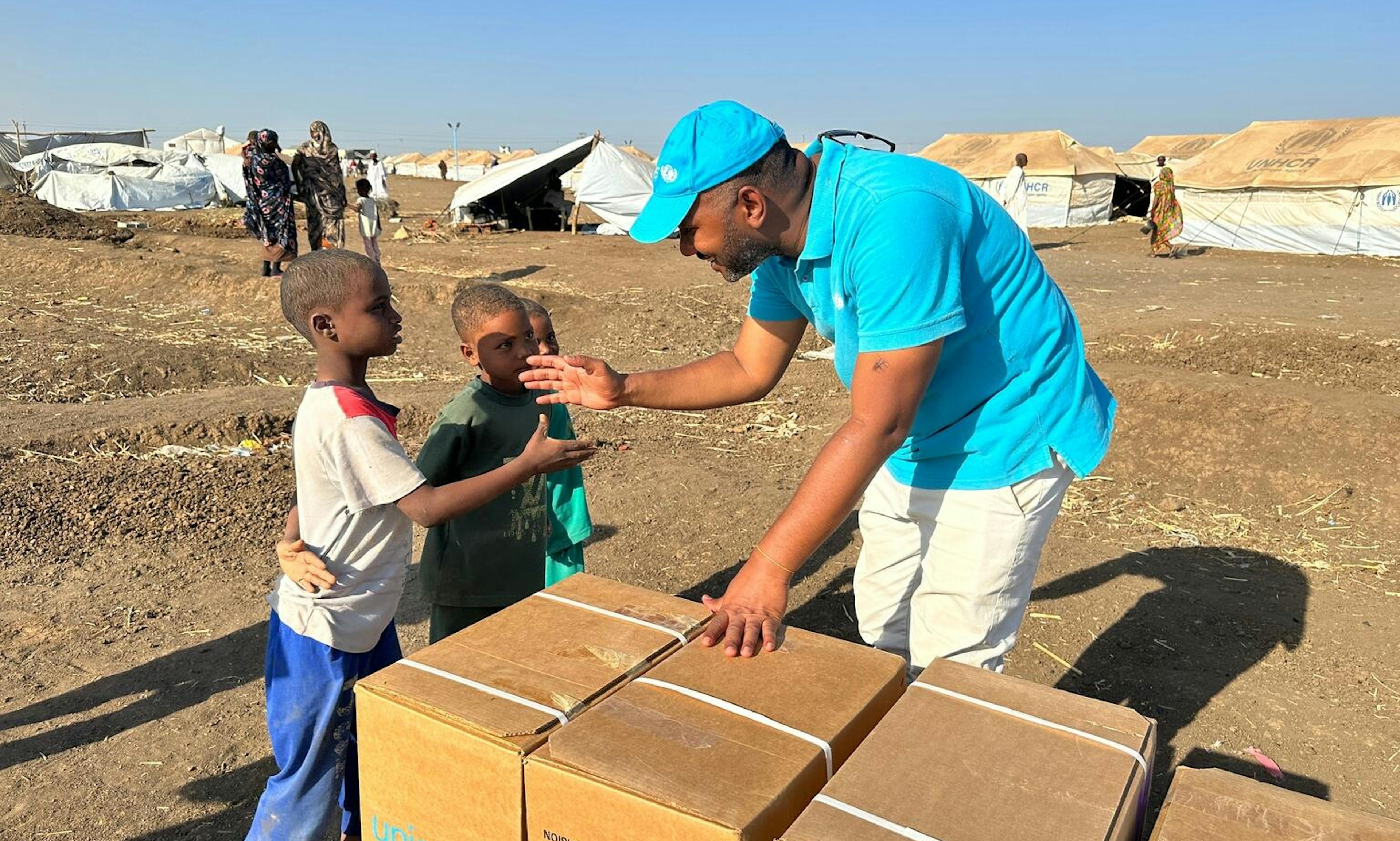 A UNICEF aid worker delivers humanitarian supplies to kids and their families in need