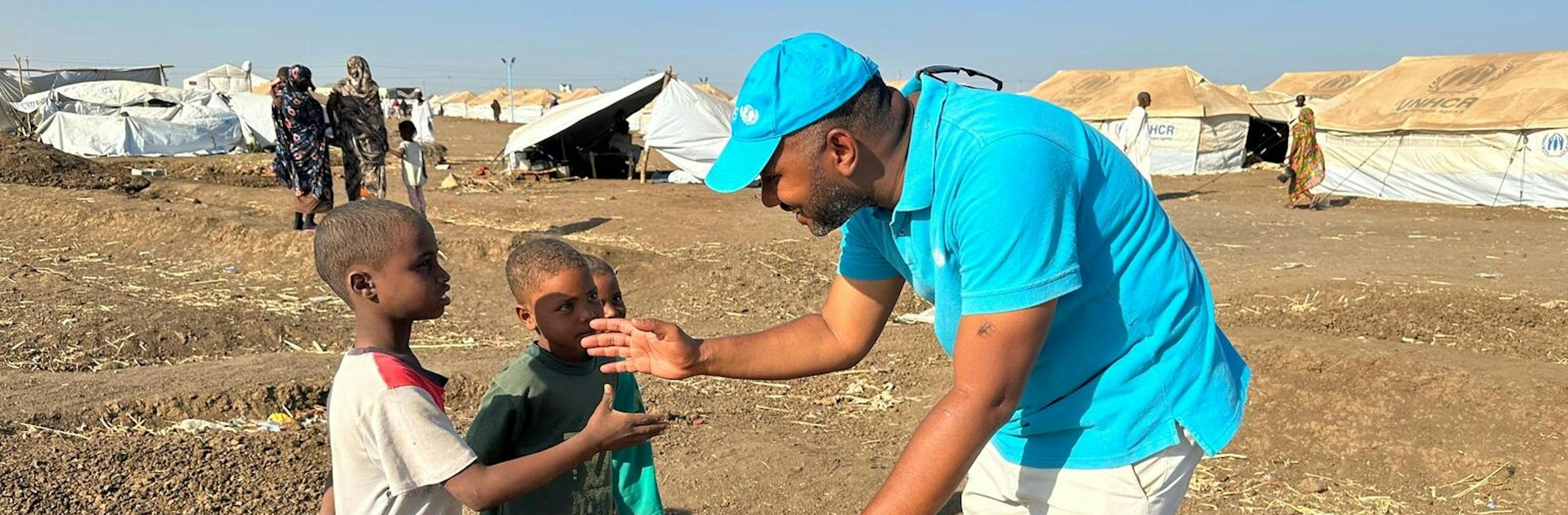 A UNICEF aid worker delivers humanitarian supplies to kids and their families in need