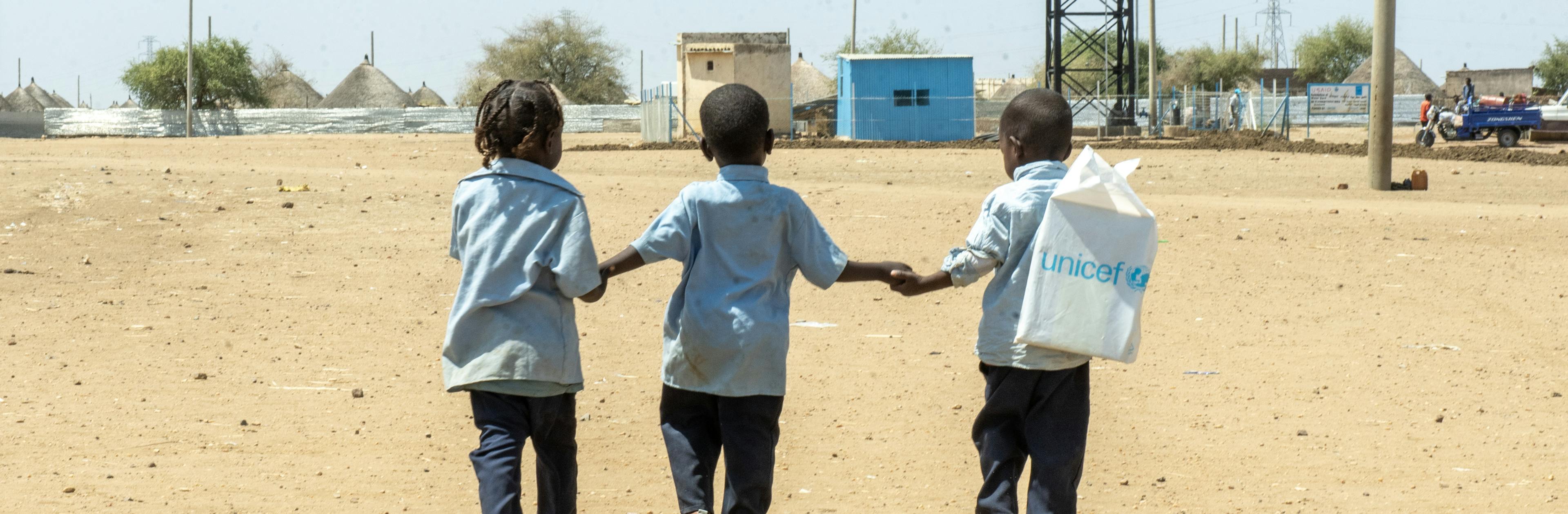 On 2 March 2025, children walk back home from a UNICEF-supported child friendly space in Al Houri internally displaced people’s (IDP) camp in Gedaref State, Sudan.