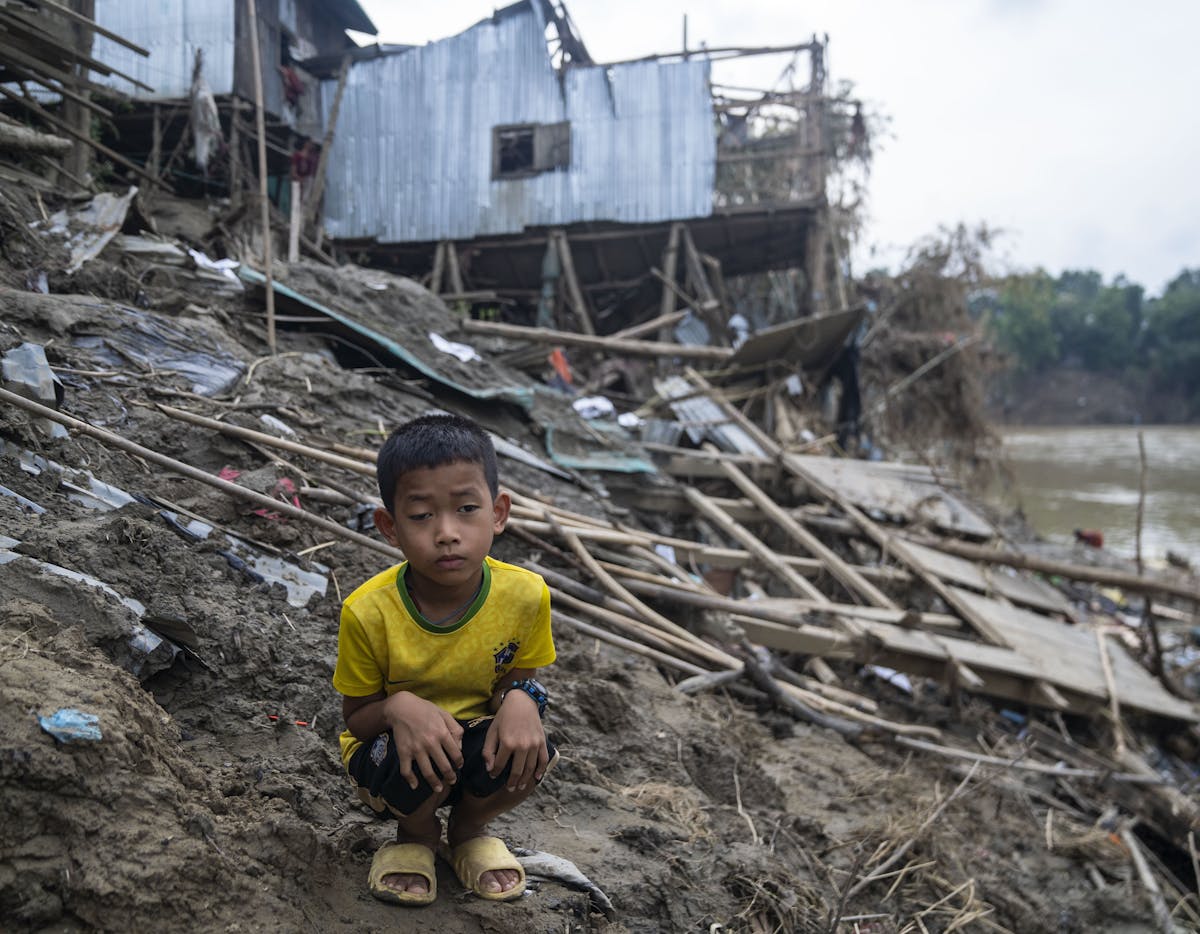 Phue Chai, 7, found refuge in a school during the flood. Now, as the school prepares to reopen, he's homeless once again.