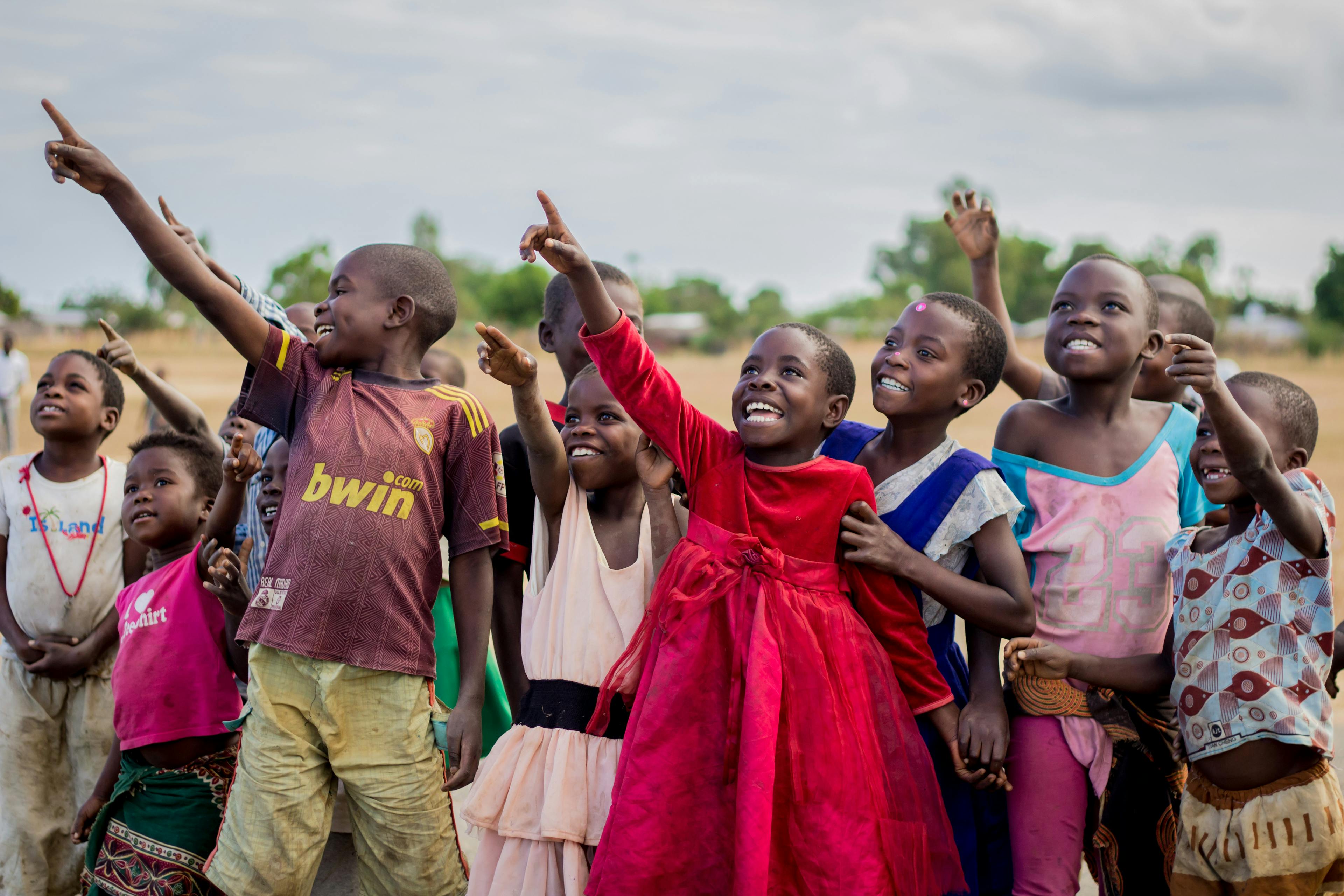 Children look on excited at the testing of unmanned aerial vehicle (UAVs) or drones by the UNICEF Innovation Team at the Kasungu Aerodrome in Kasungu in central Malawi.