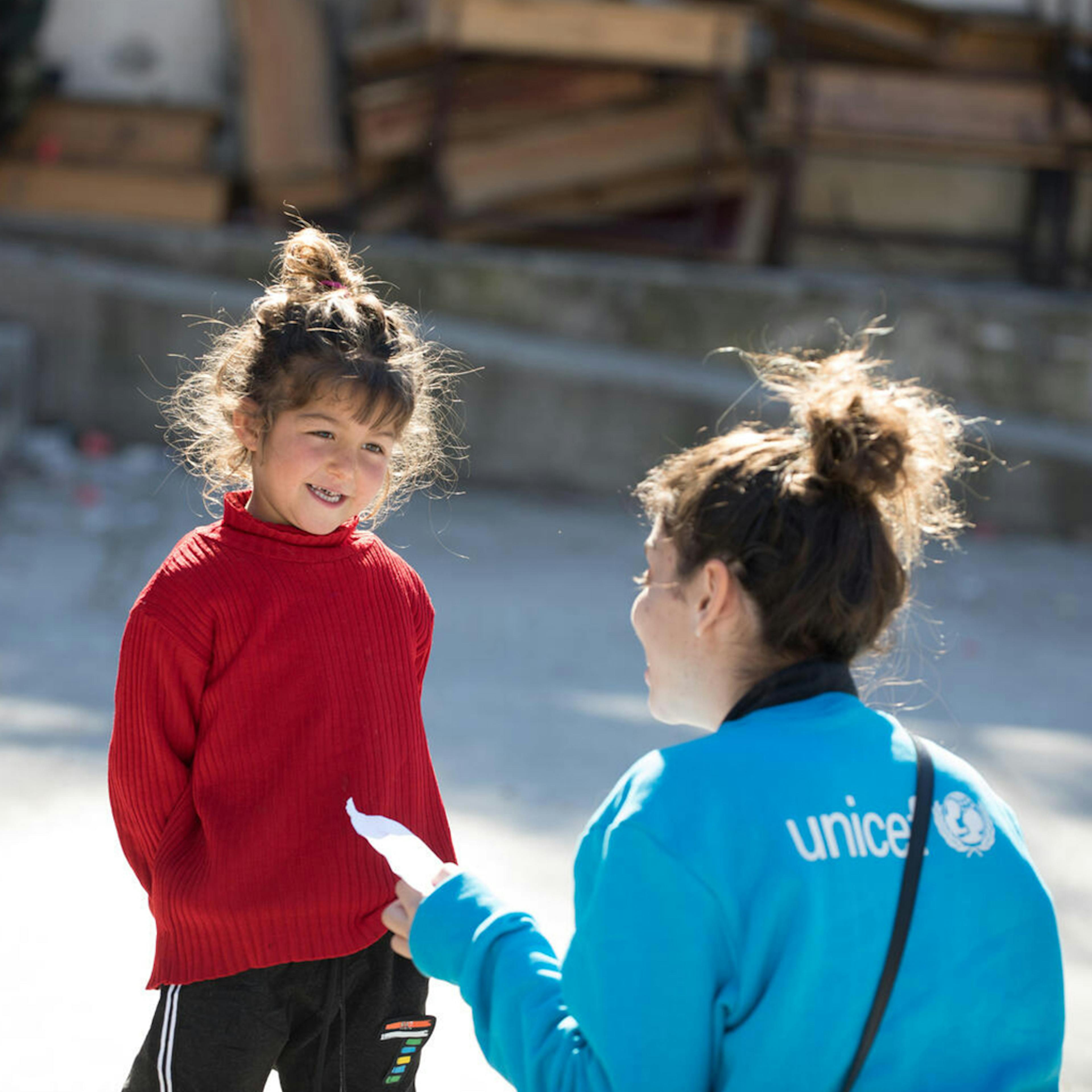 On 20 February 2023, Naya, a four-year-old girl, is seen showing her drawing to a UNICEF staff member during an art activity in a shelter in Stamo village, located in Lattakia governorate in Syria. Naya, who fled her home due to the earthquake, uses drawing as a way to express her emotions, and this activity, along with others, are provided by a UNICEF-supported partner at the shelter.