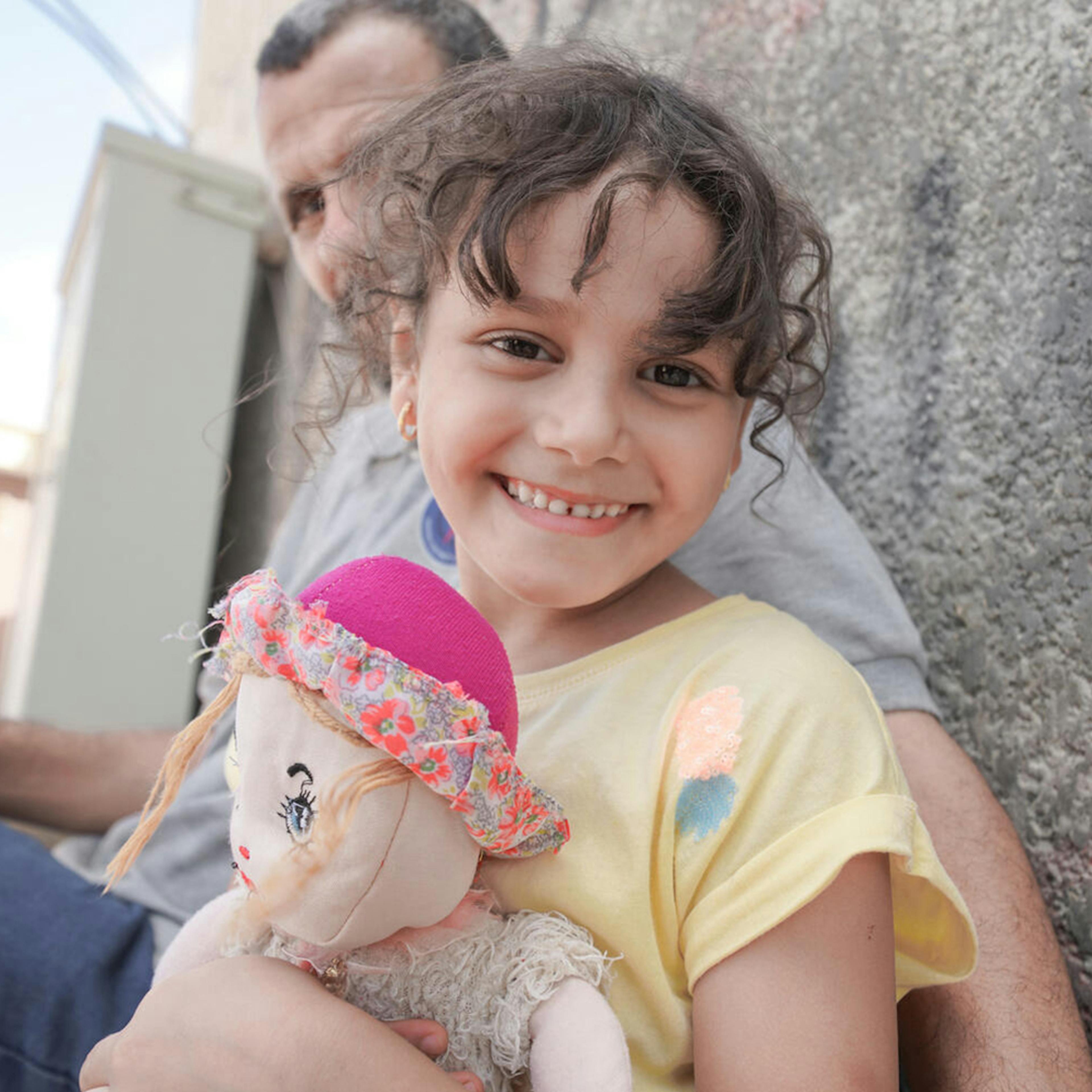 On 18 September 2023, a child smiles for a photo in flood-affected Soussa, Eastern Libya.