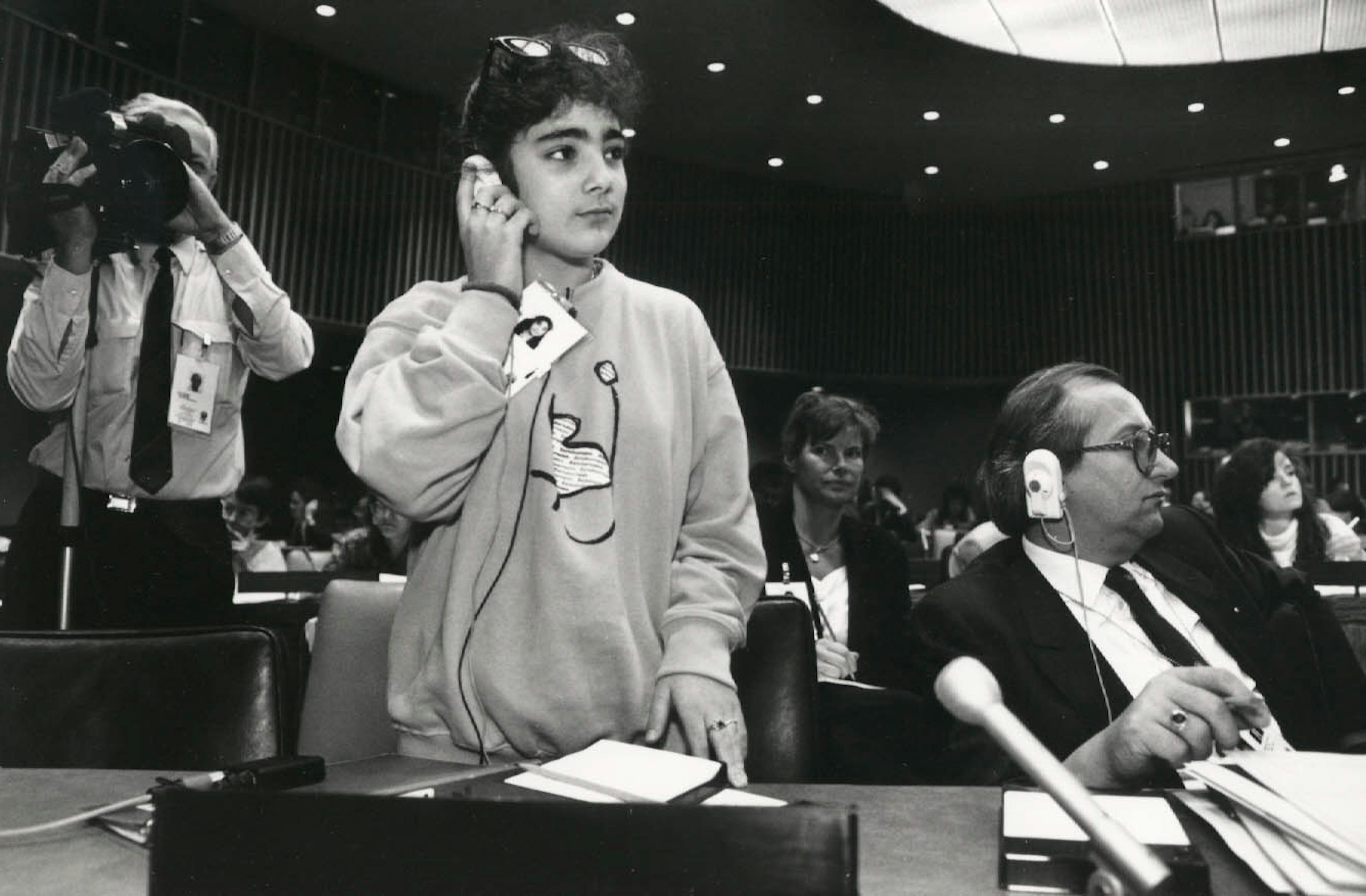 A young journalist attending the Saturday morning press briefing summit, co-chaired by UNICEF executive director James grant and Chilean president Patricio Aylwin. She was one of many young journalists covering the world summit for children.