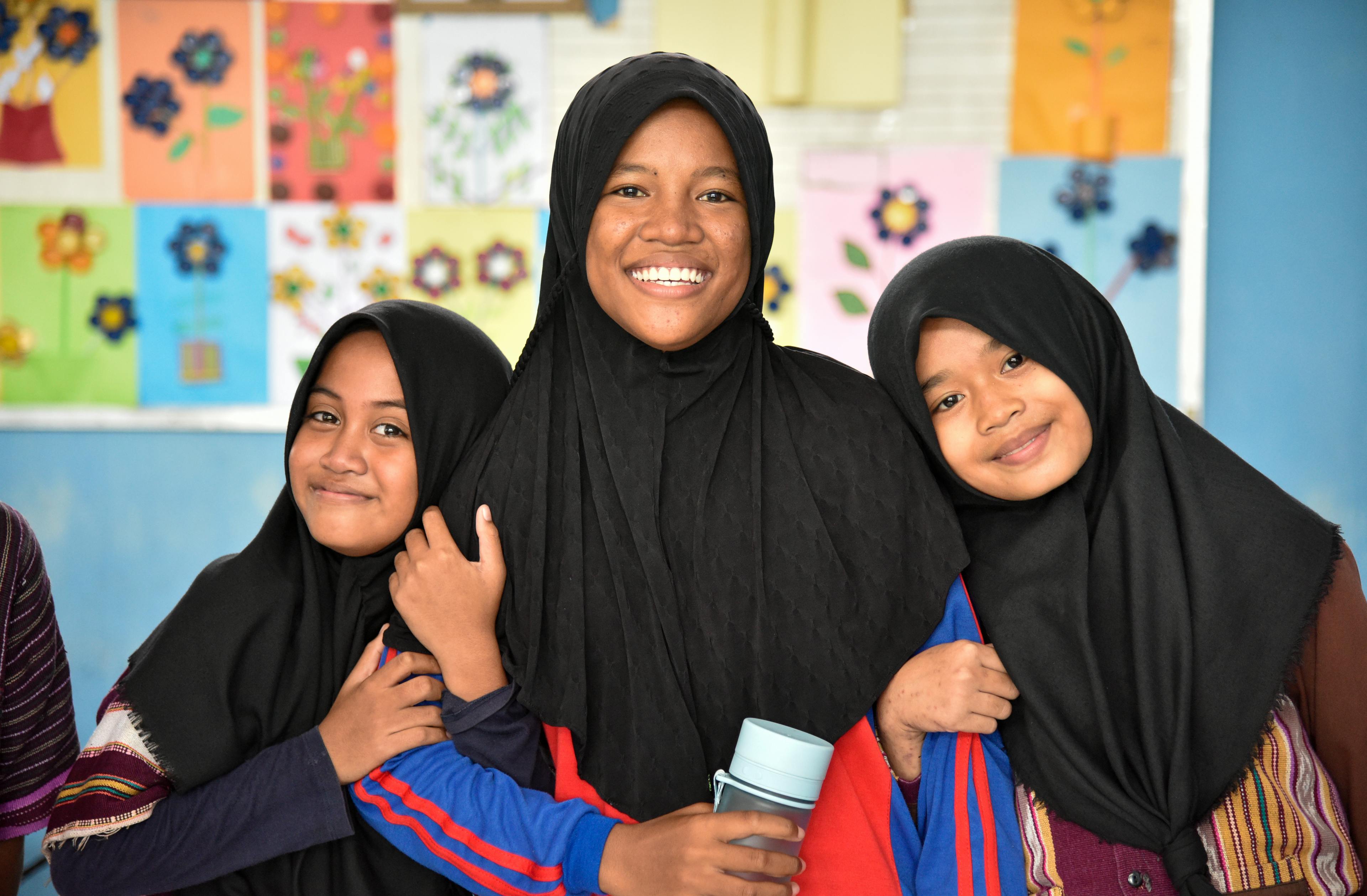 A group of girls from Kampung Baru Primary School in Larantukaafter, Indonesia after a discussion on menstrual hygiene inside their class using OkyApp, the first period tracker created by girls for girls in Indonesia.