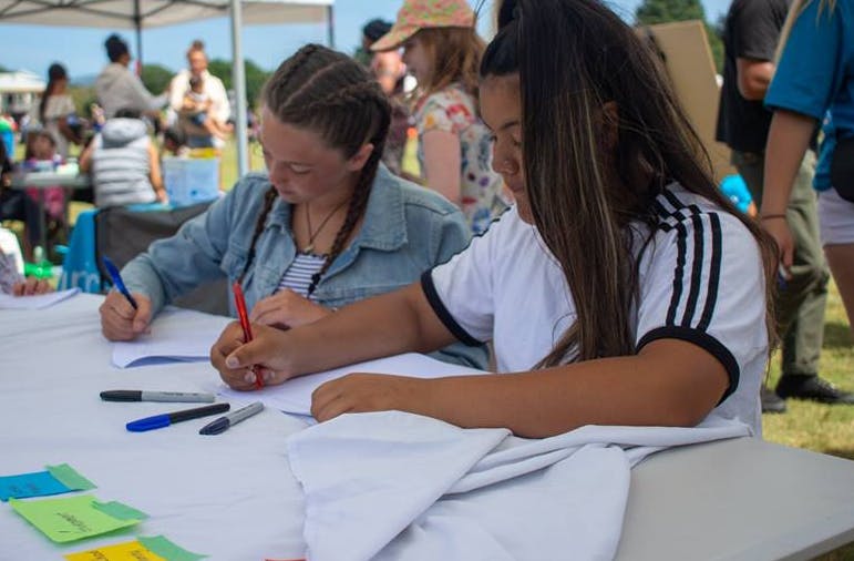 Girls doing a survey for Te Hiringa Tamariki