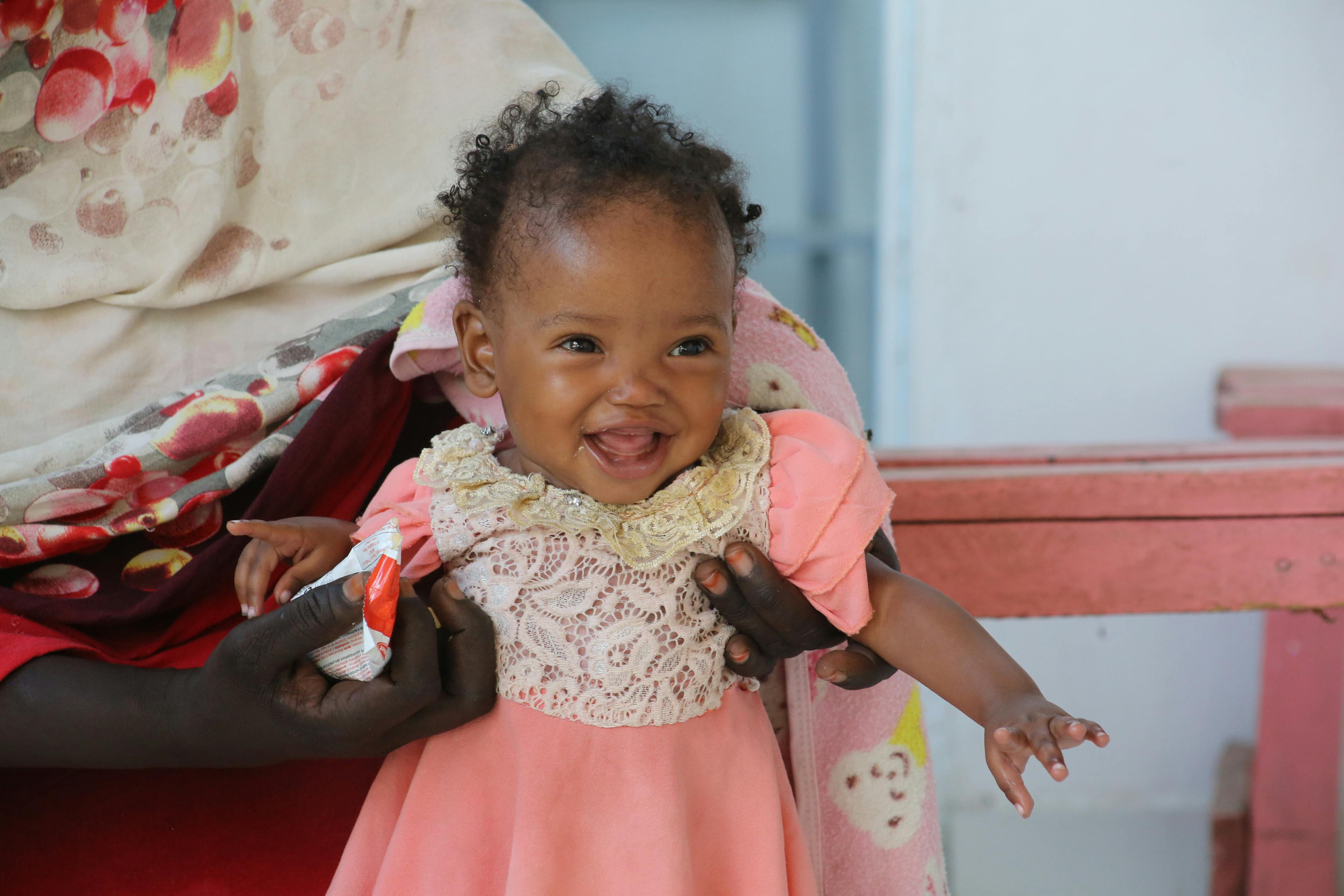 7-month-old Genan and her aunt and caretaker Rehab, during a visit to Damazine Children's hospital in Sudan where she was admitted to their nutrition programme. 