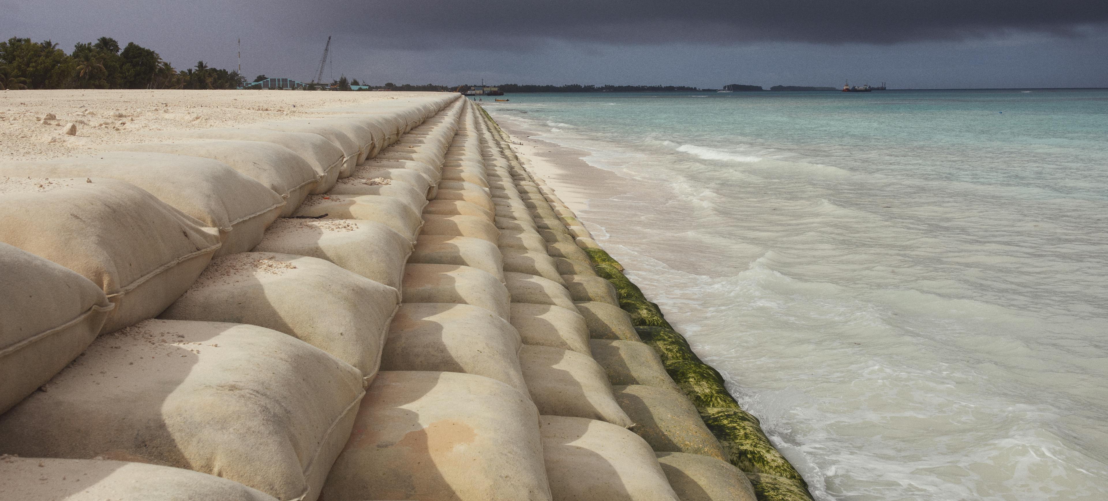 Sandbags around the perimeter of "The Reclaimed Land", an area built in Tuvalu to protect the land from erosion.