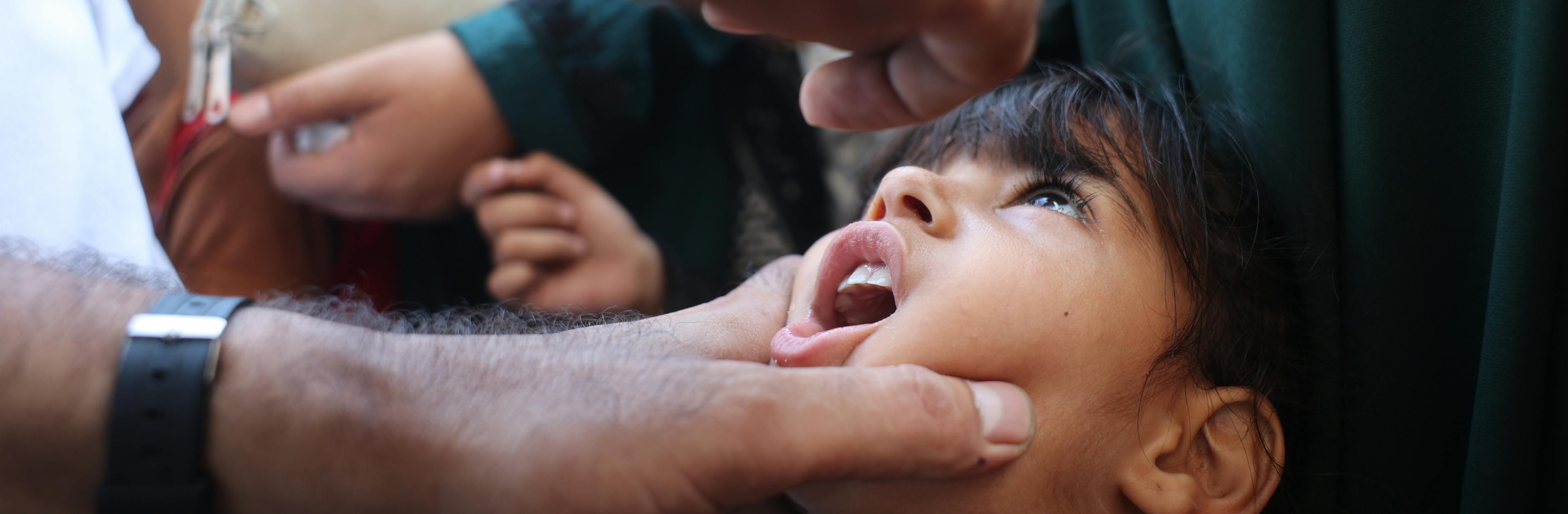 Health workers begin administering polio vaccines at the Az Zawayda Clinic in the central Gaza Strip.