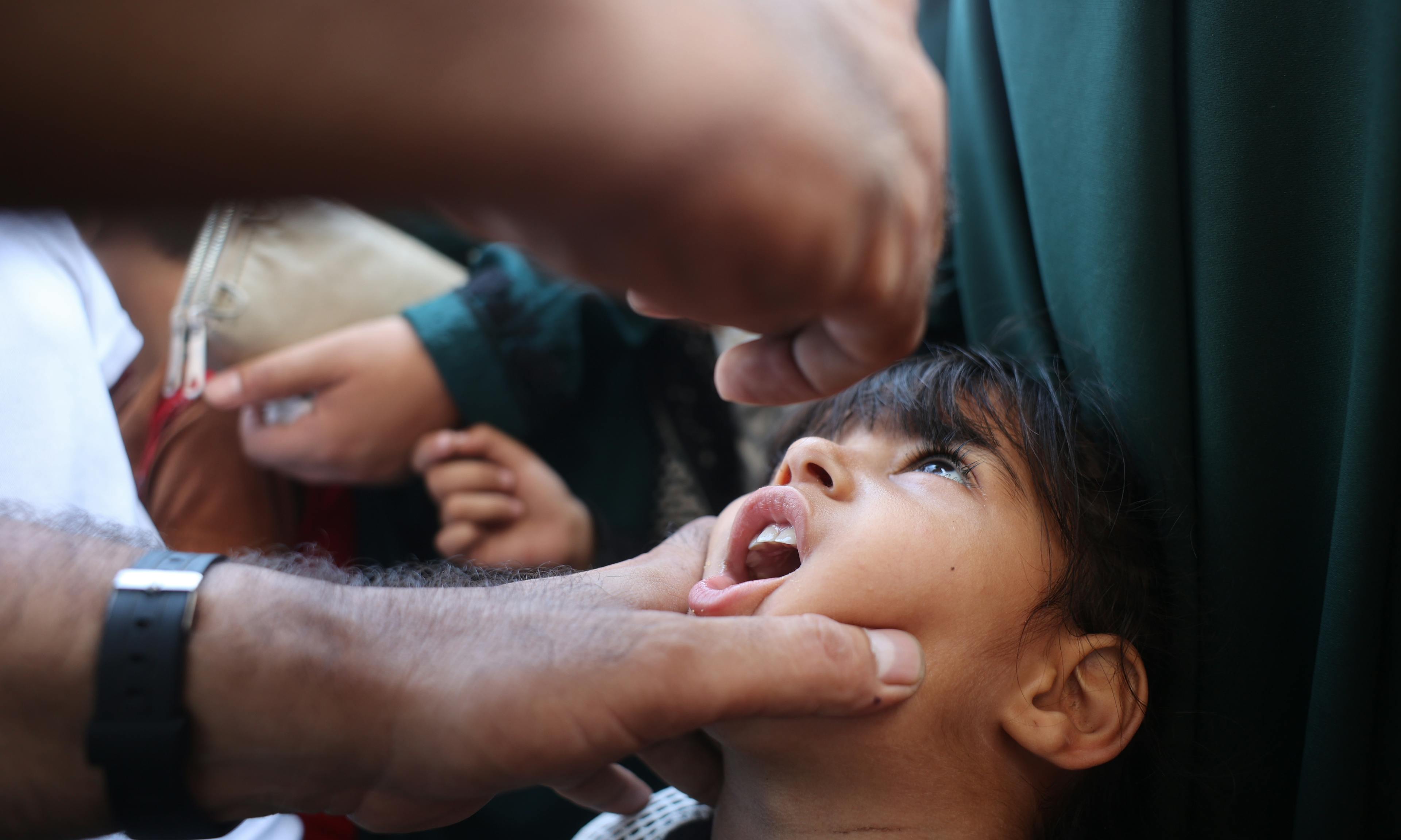 Health workers begin administering polio vaccines at the Az Zawayda Clinic in the central Gaza Strip.