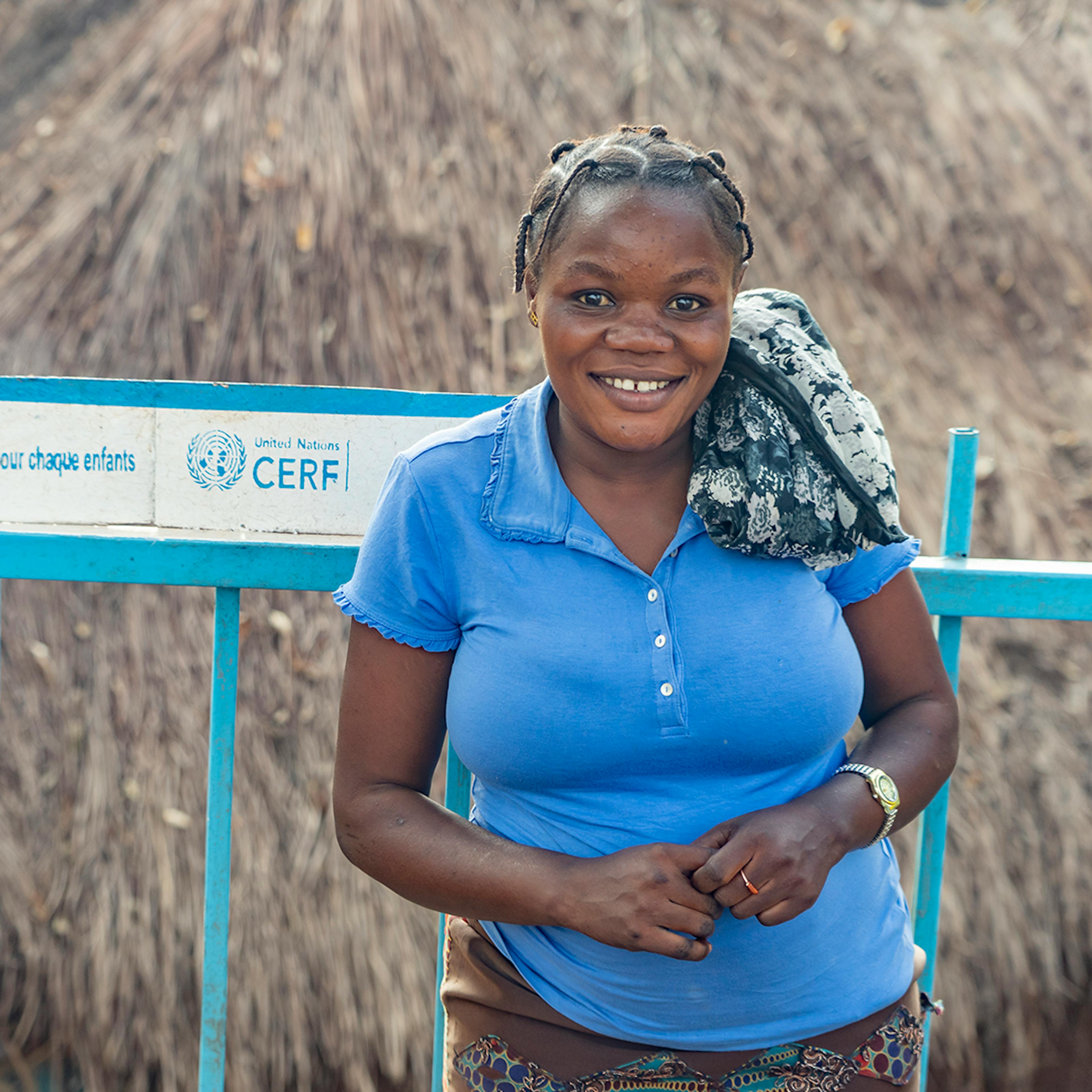 Déborah Dhra, mother of 2, fills her jerrycan with water at a tap installed by UNICEF with the support of UNCERF in Masumbuko, Ituri province, DR Congo on June 19, 2024.