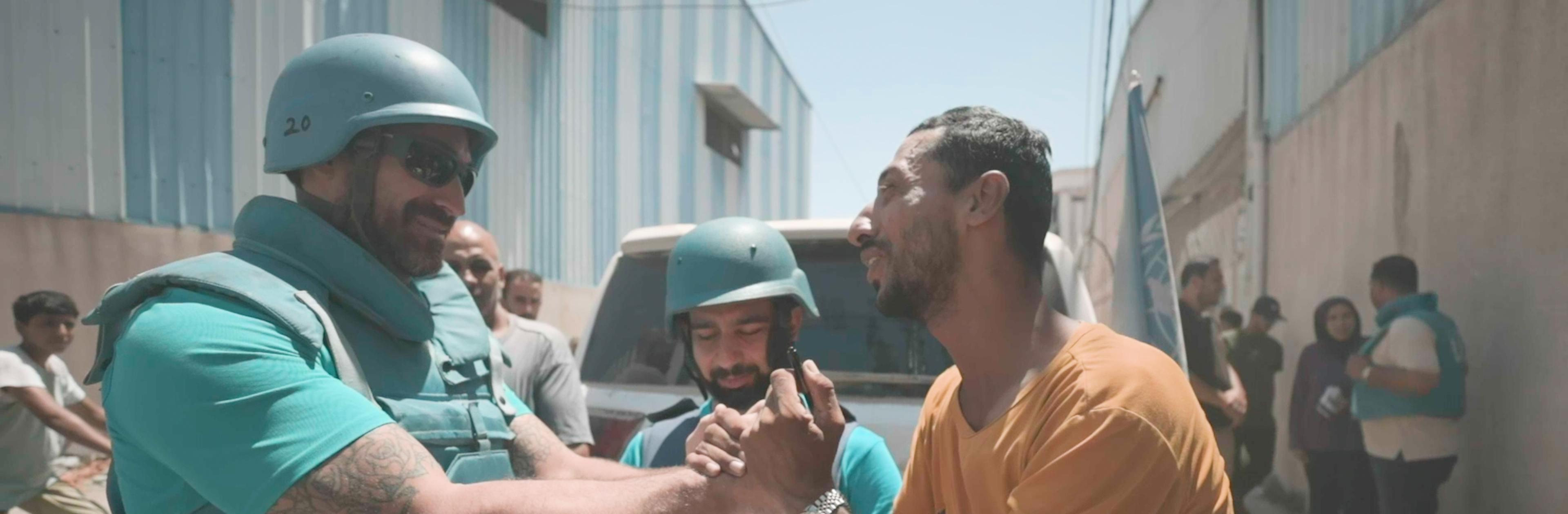 On the 6th of August, Tuesday, after being reunited with his children, Abdullah holds the hand of Matthew DeCristofano, a UNICEF staff member, Child Protection Specialist, thanking him during a mission to reunite 7 children from the south to the middle and north of Gaza with their caregivers, bringing hope to families torn apart by conflict.