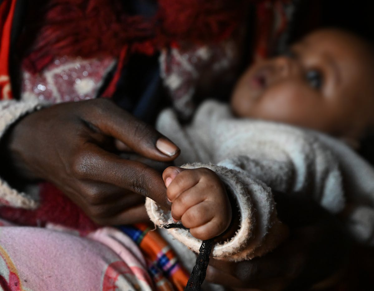 Hope, a 18 year old girl with her baby, at the Dubluk Wereda IDP site, in the Borena zone, Oromia region, in the south of Ethiopia.