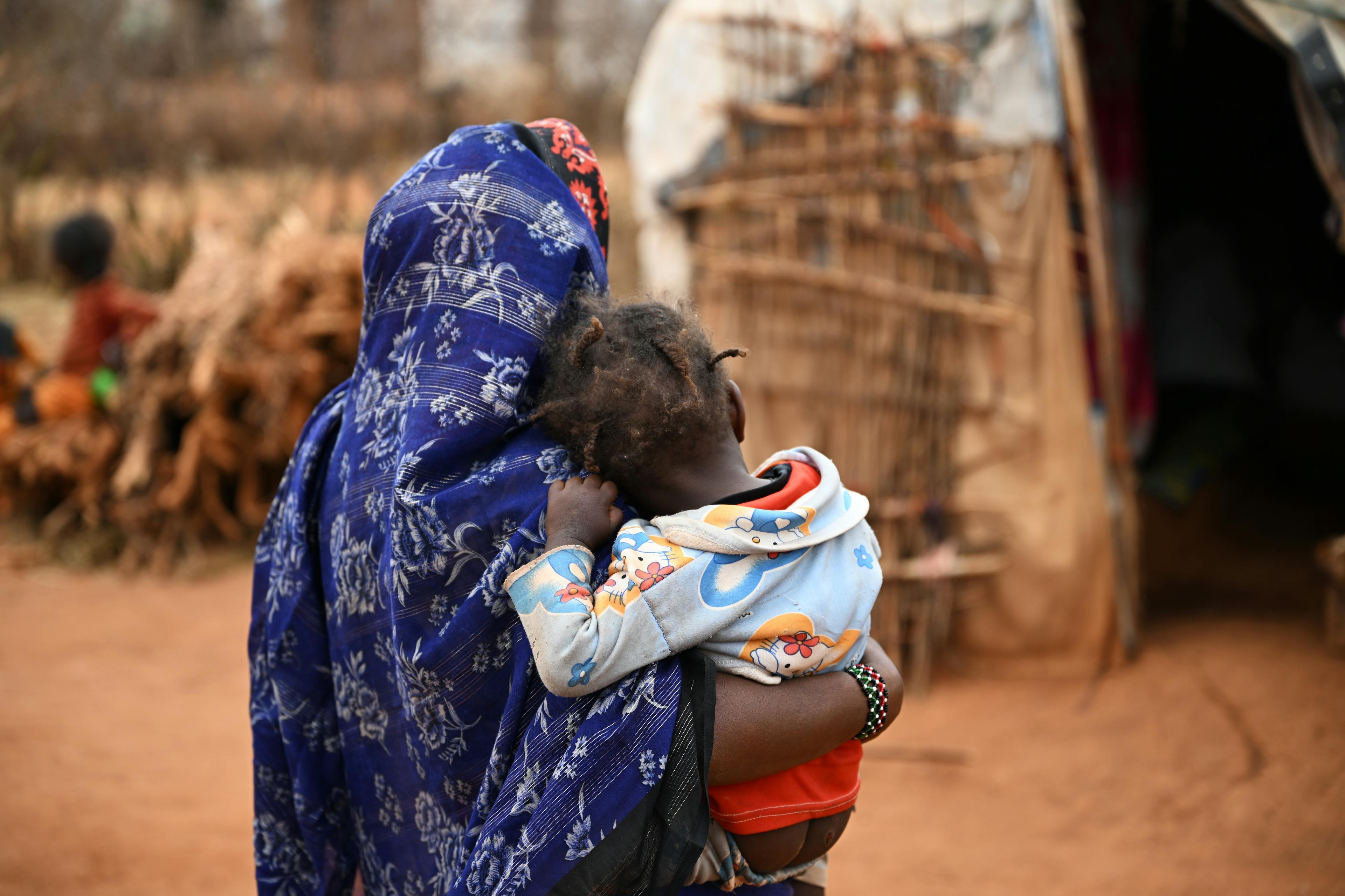 Xume, a 15 year old girl with her child, at the Dubluk Wereda IDP site, in the Borena zone, Oromia region, in the south of Ethiopia.