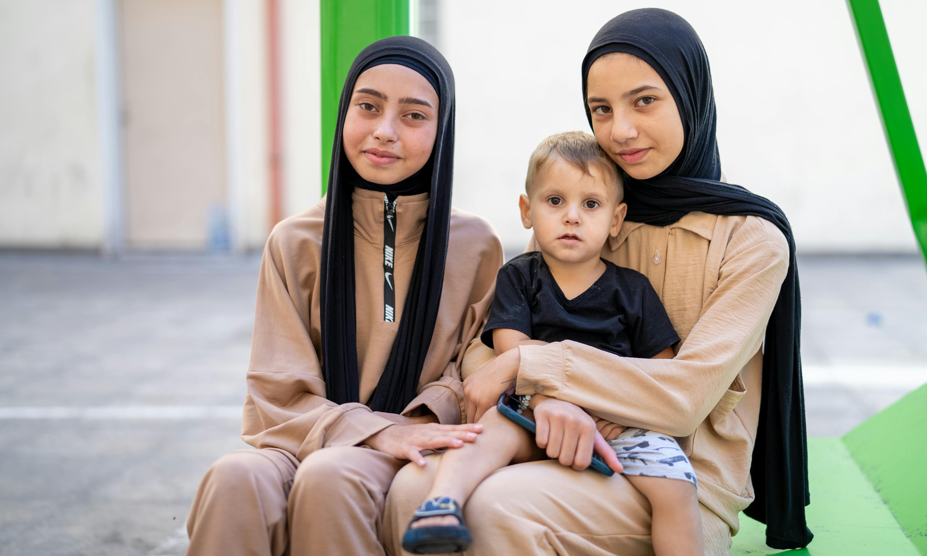 Luna, Fatima, and Amir, aged 15, 15, and 2, were displaced from south Lebanon and are now living in a shelter in Beirut.